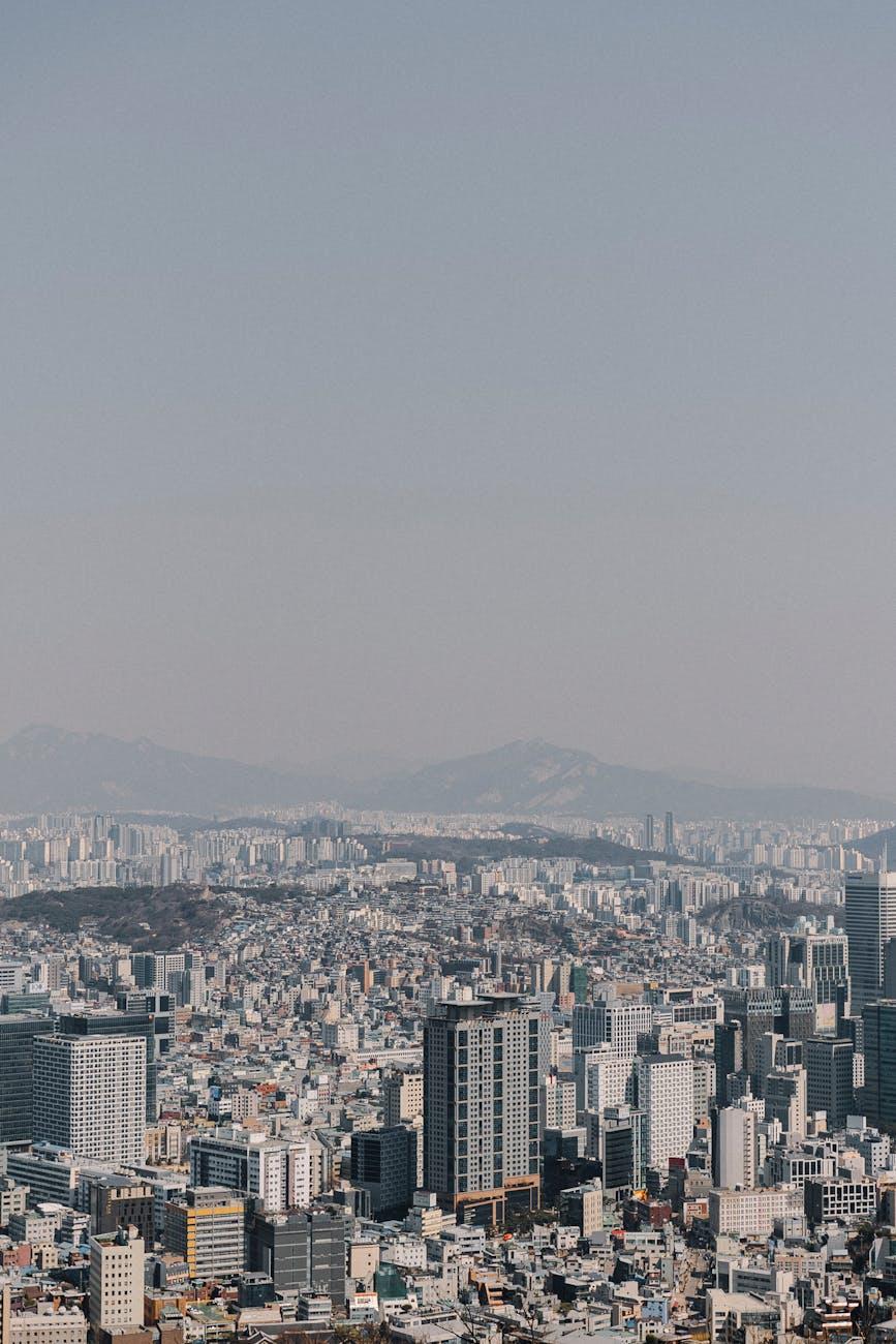 Sprawling high-rise cityscape fading into a hazy distance