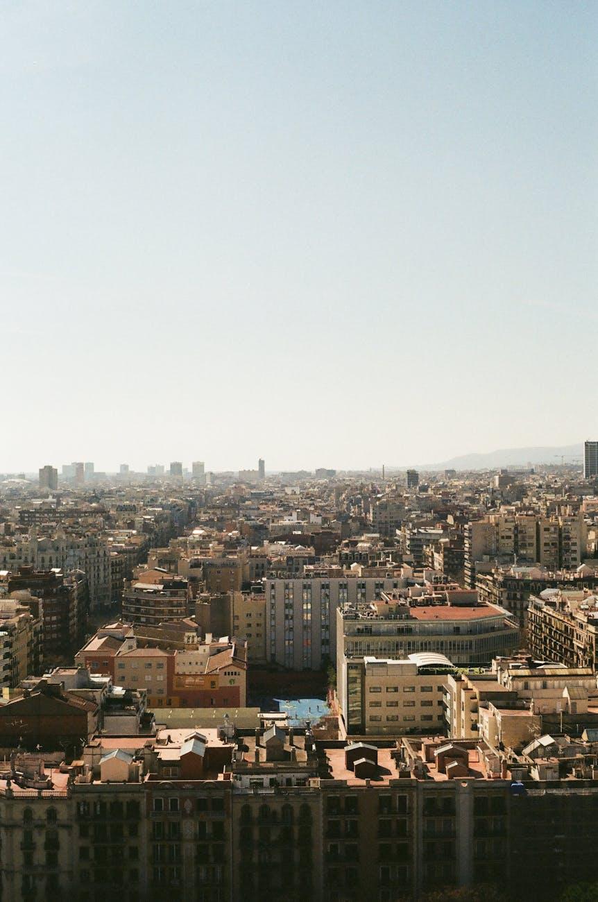 Dense urban rooftops stretching toward a hazy horizon
