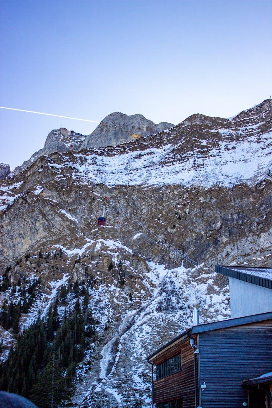 Stunning winter landscape of Mount Pilatus featuring snowy peaks and cable car