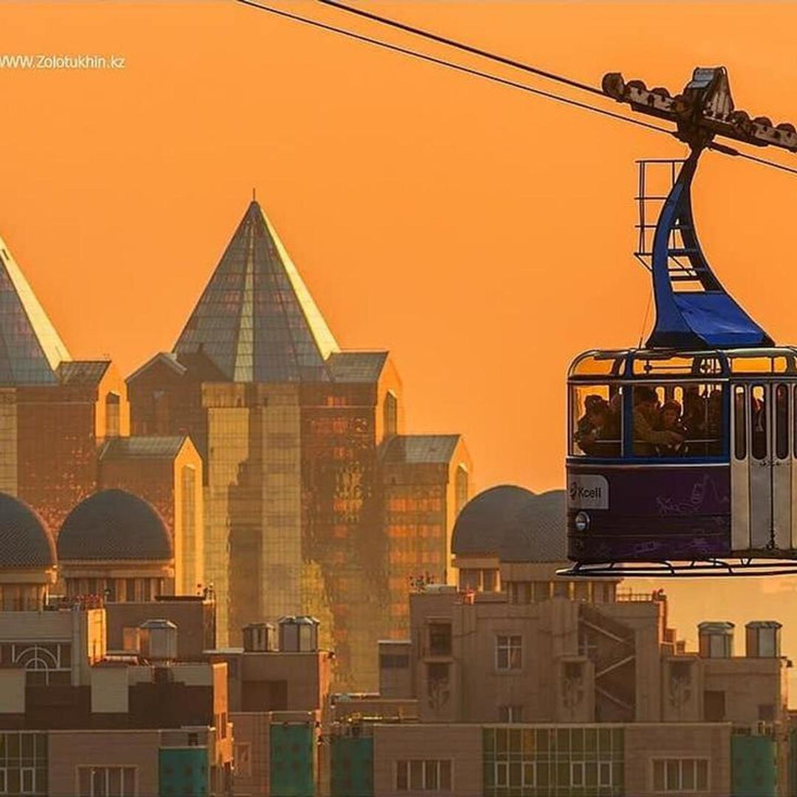 Snow-capped Tien Shan mountains rising behind the Almaty skyline