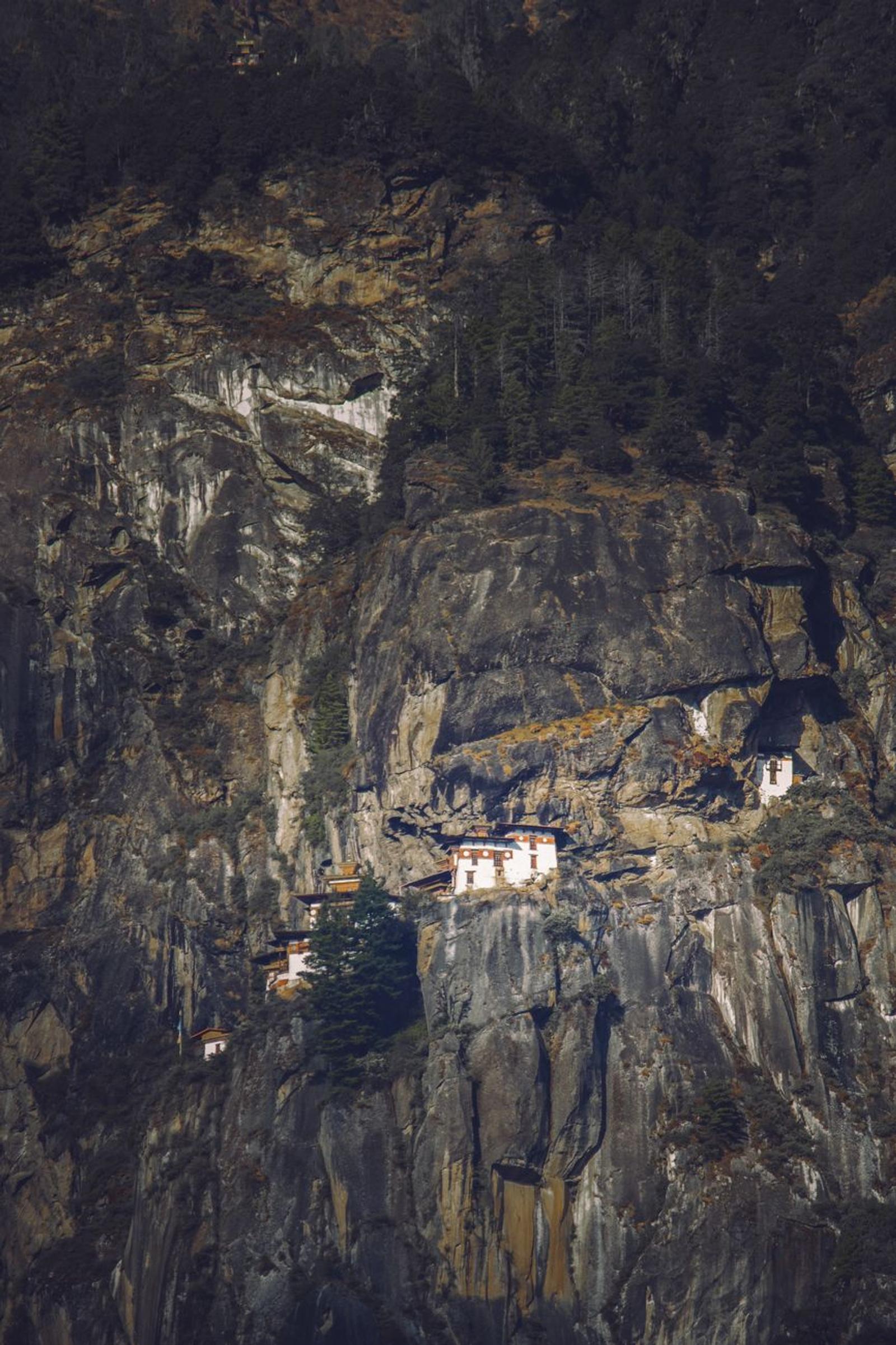 Scenic cliffside monastery nestled in the rocky mountains of Bhutan