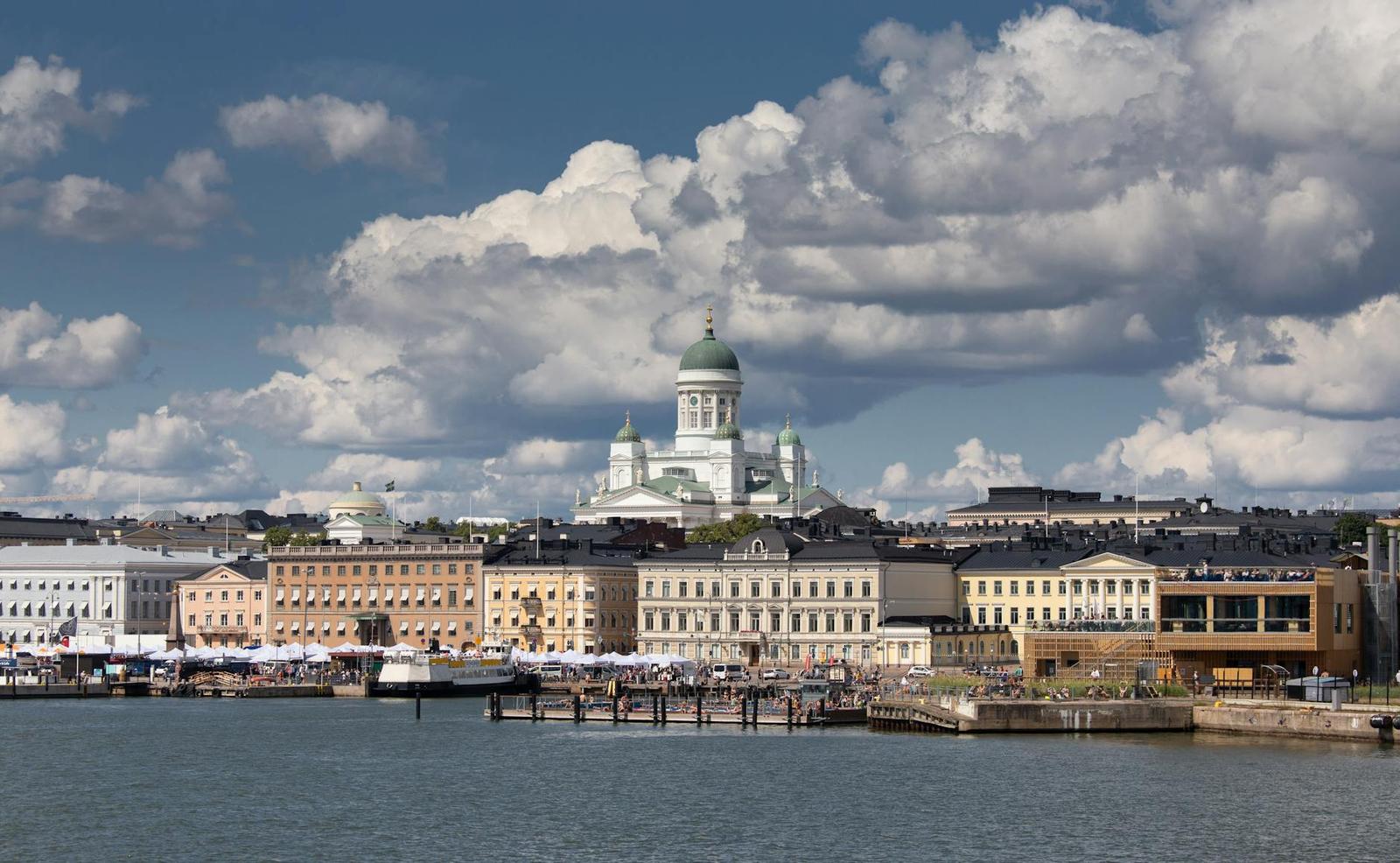 Domed cathedral seen across the harbour on a bright cloudy day