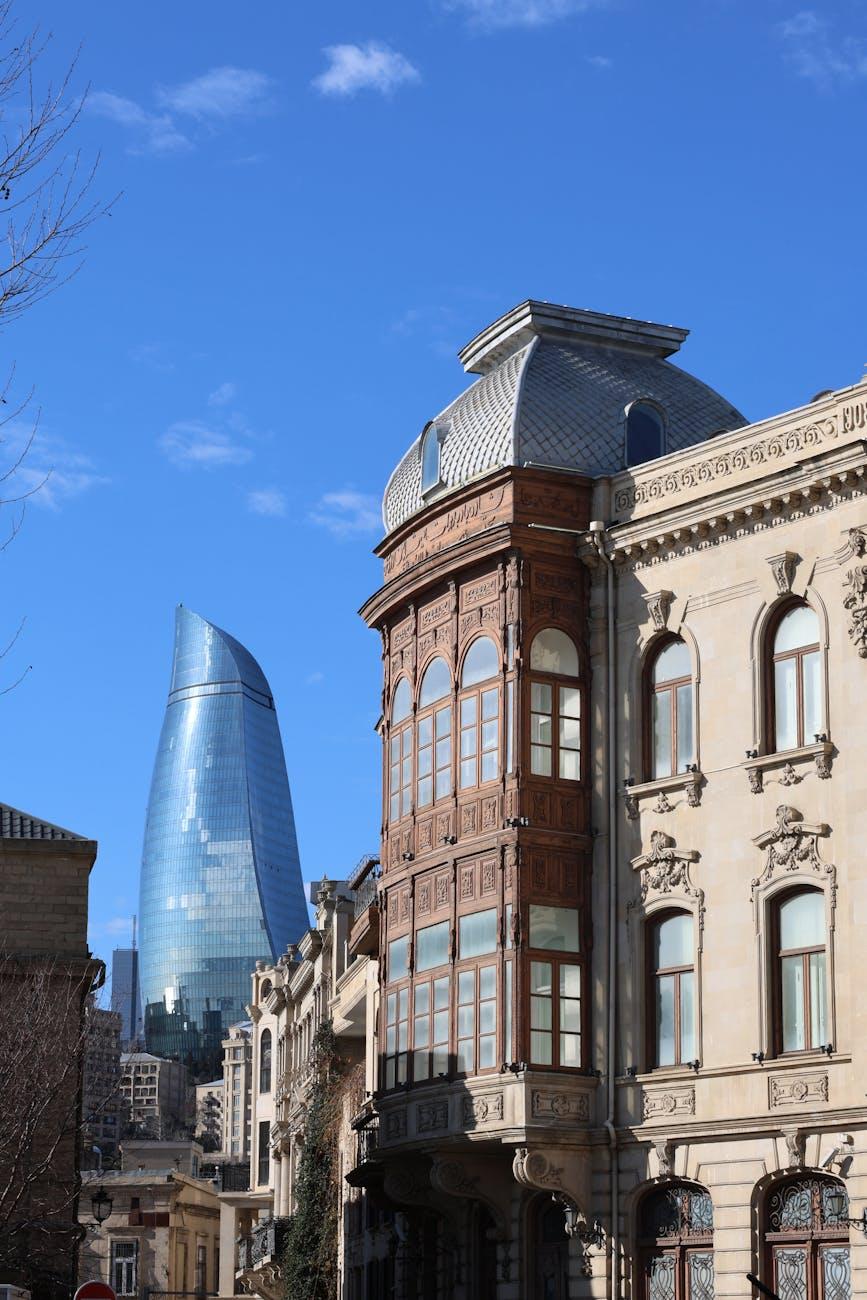 Baku city skyline showcasing modern and historic architecture under a clear blue sky