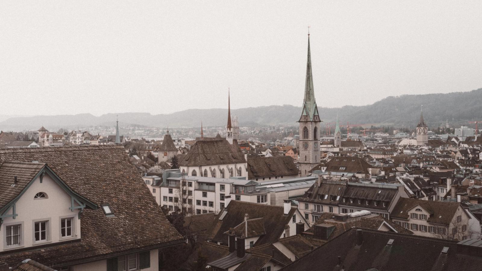 Aerial view of the picturesque old town of Zürich, highlighting historical architecture and iconic churches