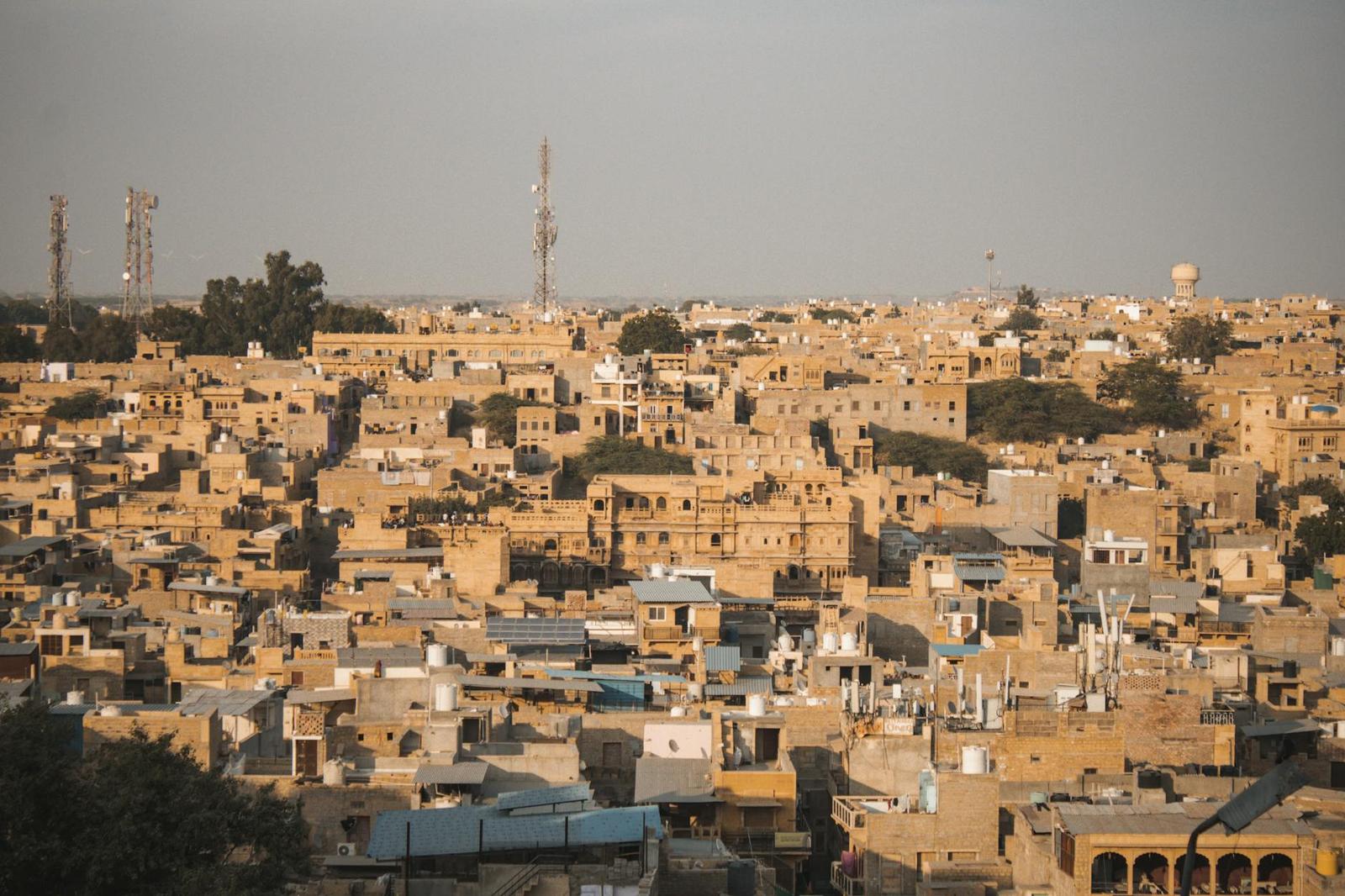 Aerial view of a dense desert town of sand-coloured flat-roofed houses