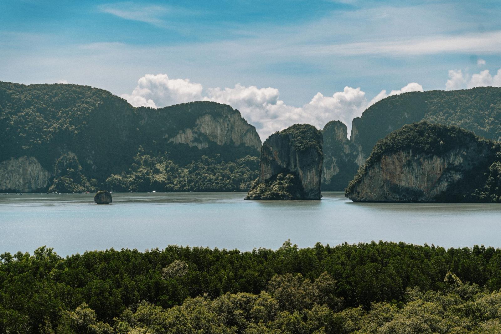 Tranquil view of limestone cliffs and lush greenery in Krabi, Thailand