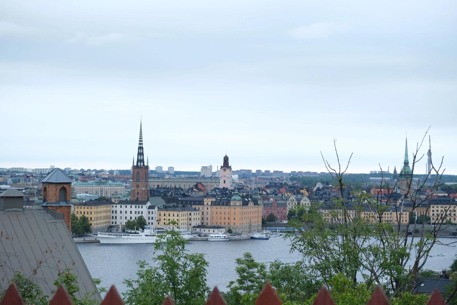 A stunning aerial view of Stockholm's historic architecture and waterways under a cloudy sky