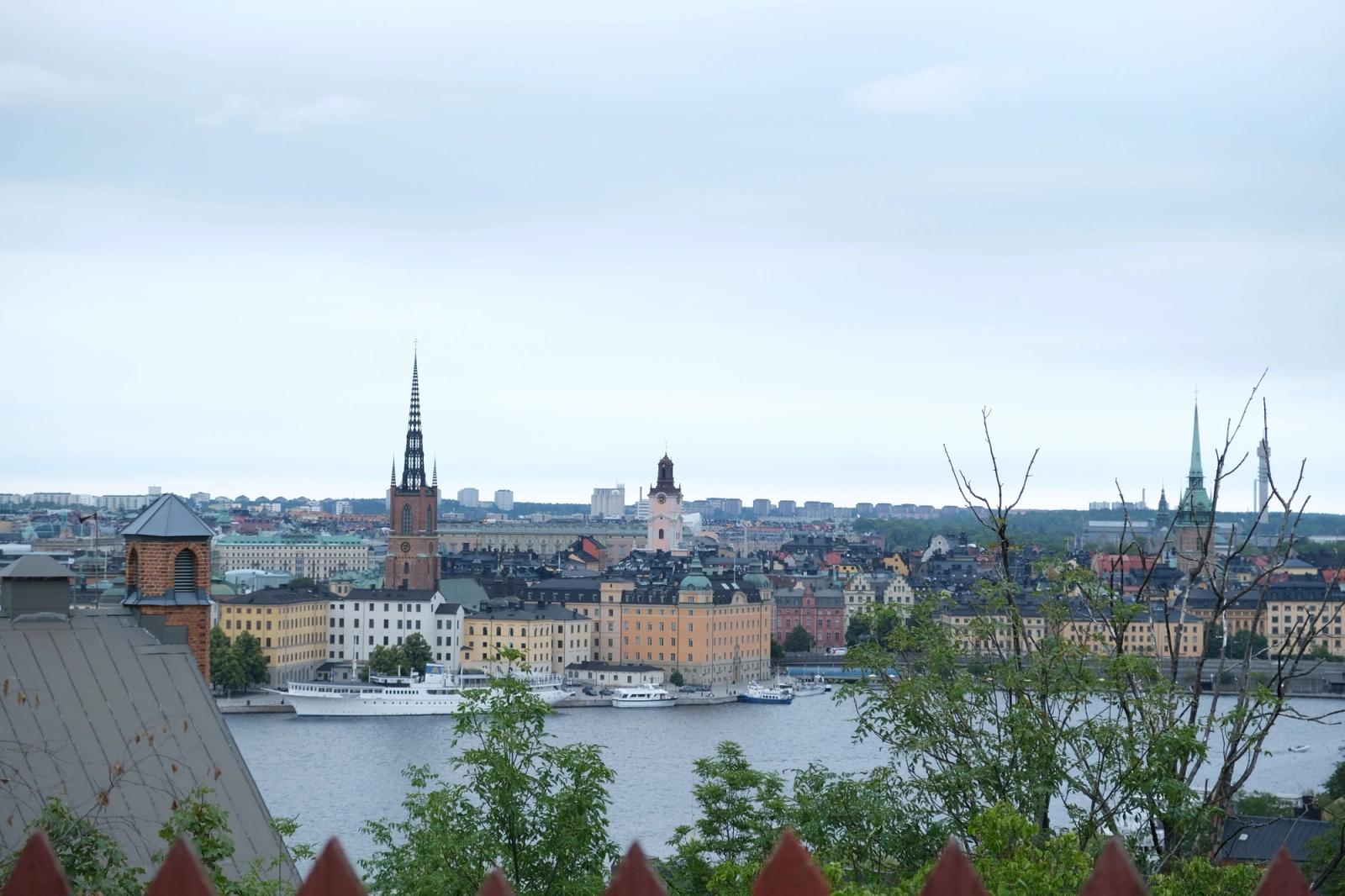 A stunning aerial view of Stockholm's historic architecture and waterways under a cloudy sky