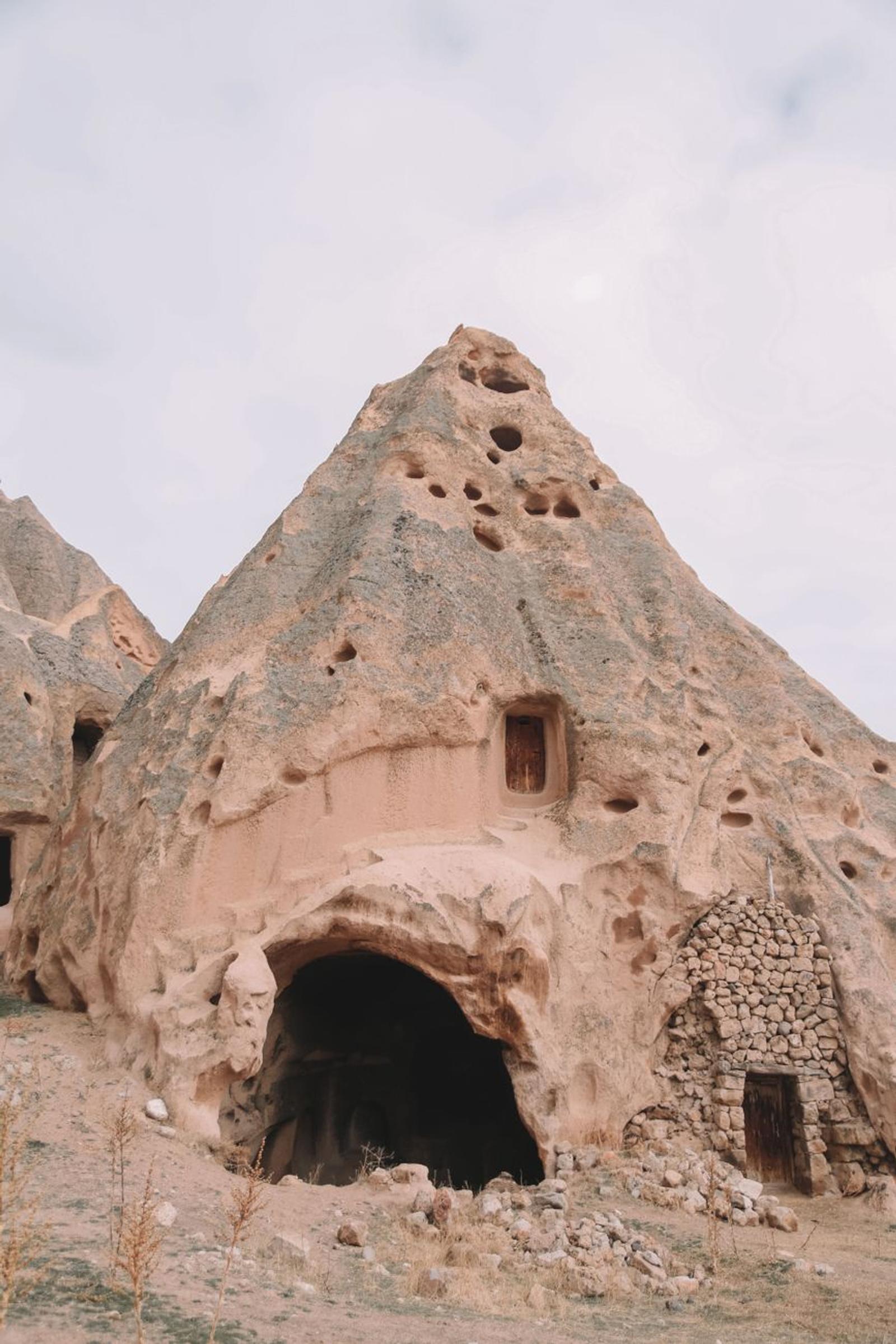 Carved fairy chimney dwelling with doorways cut into soft rock
