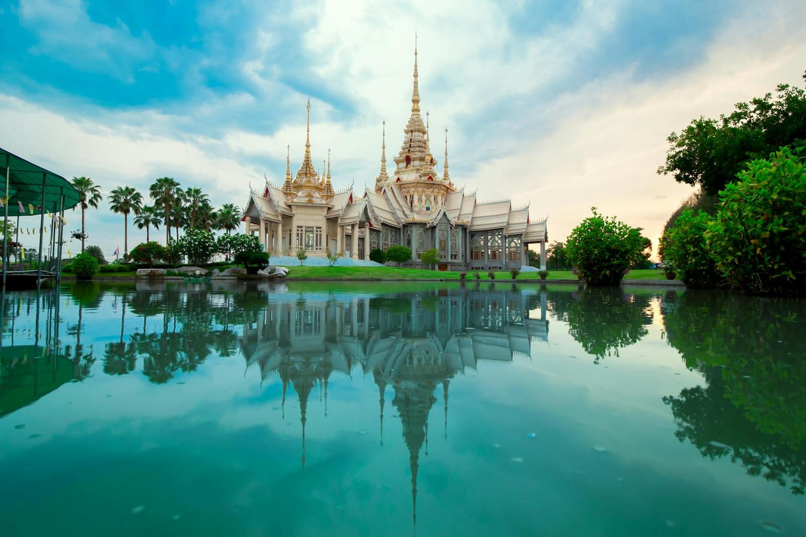 Beautiful Thai temple with serene reflection in water