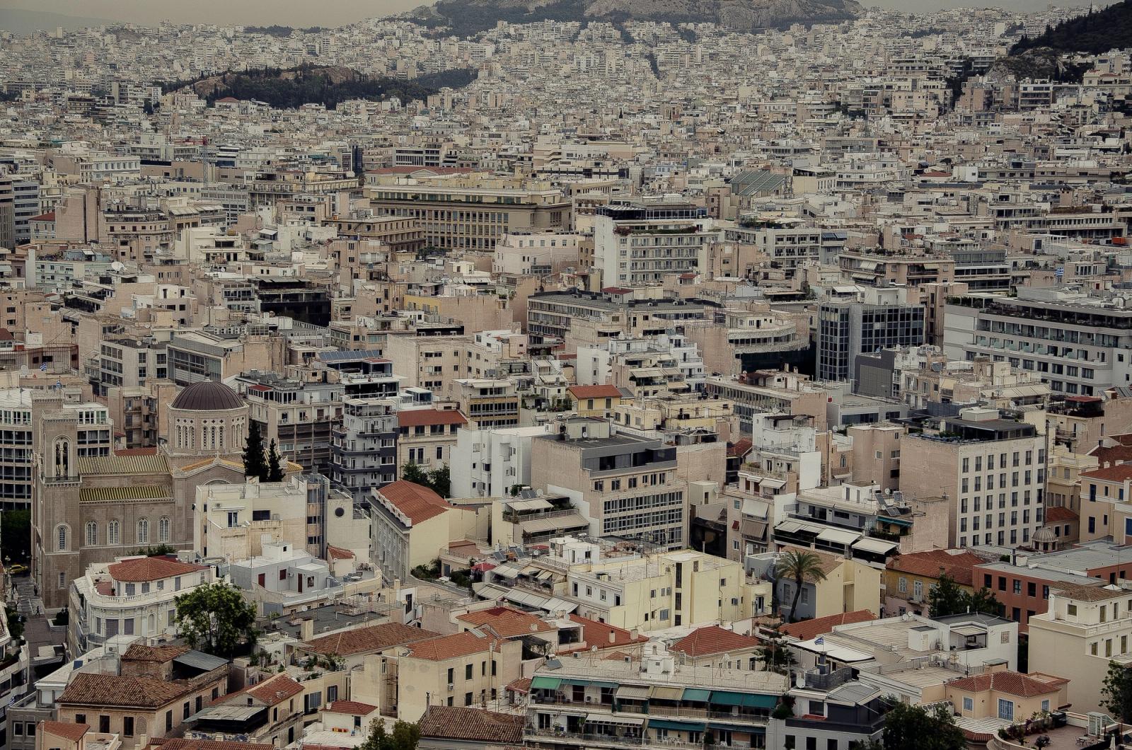 Dense urban cityscape of Athens with traditional architecture and rooftops