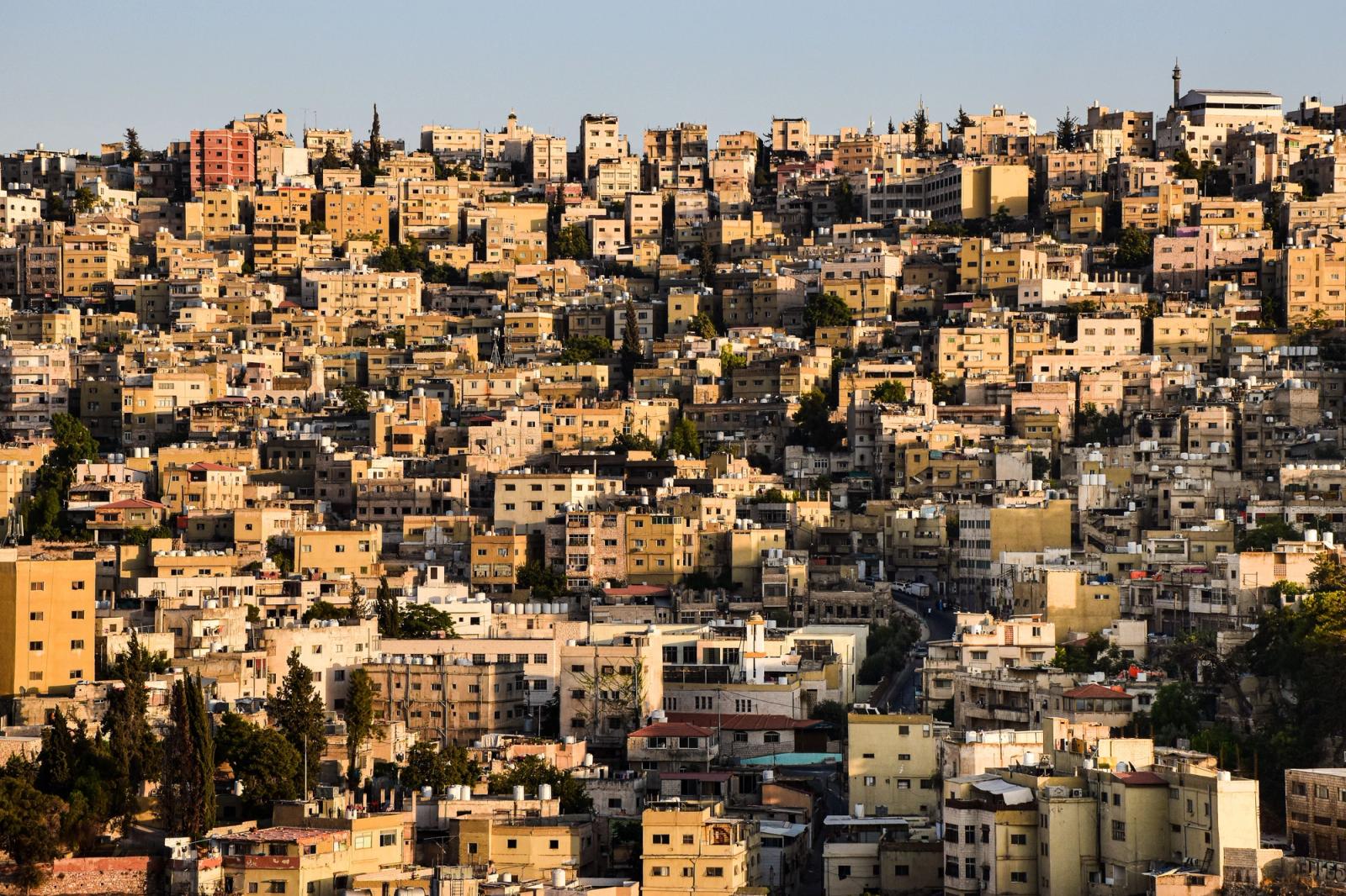 An elevated view of Amman's densely packed buildings capturing the warm urban landscape