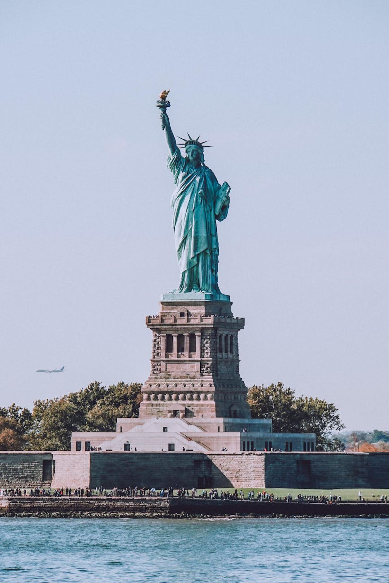Iconic view of the Statue of Liberty with a clear blue sky in New York City