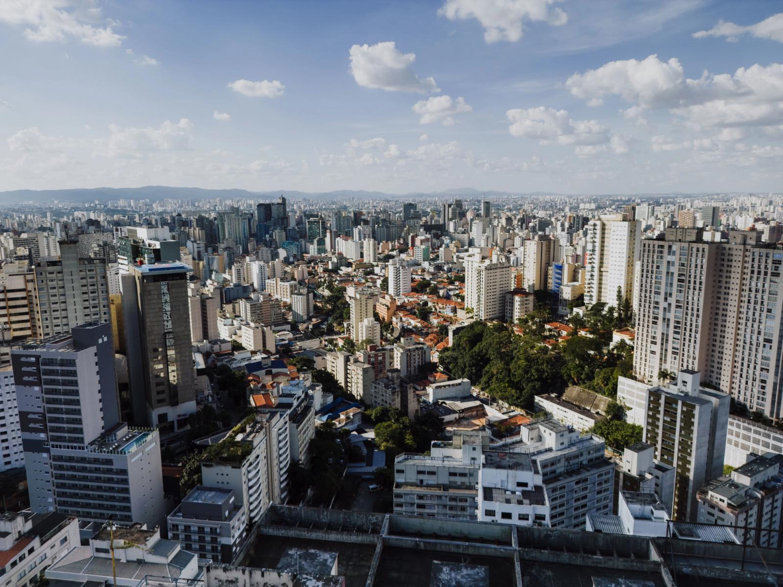 Stunning aerial view of São Paulo's sprawling cityscape with clear skies and modern skyscrapers