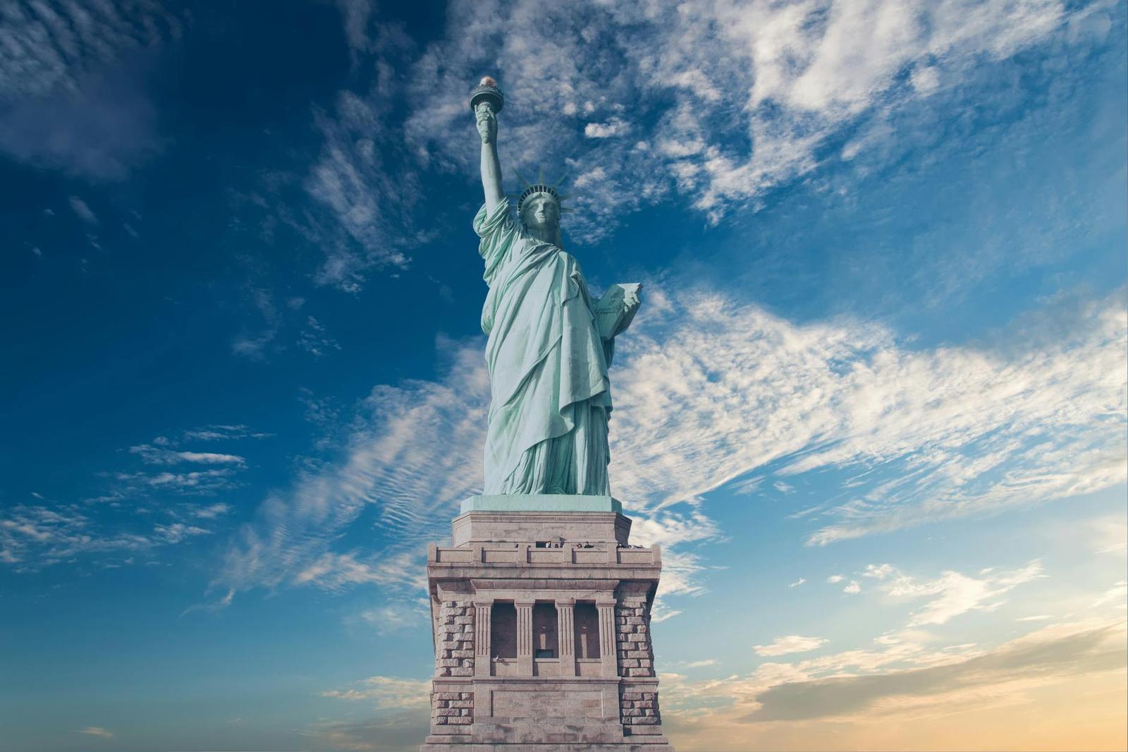 Iconic Statue of Liberty with a backdrop of a vibrant blue sky