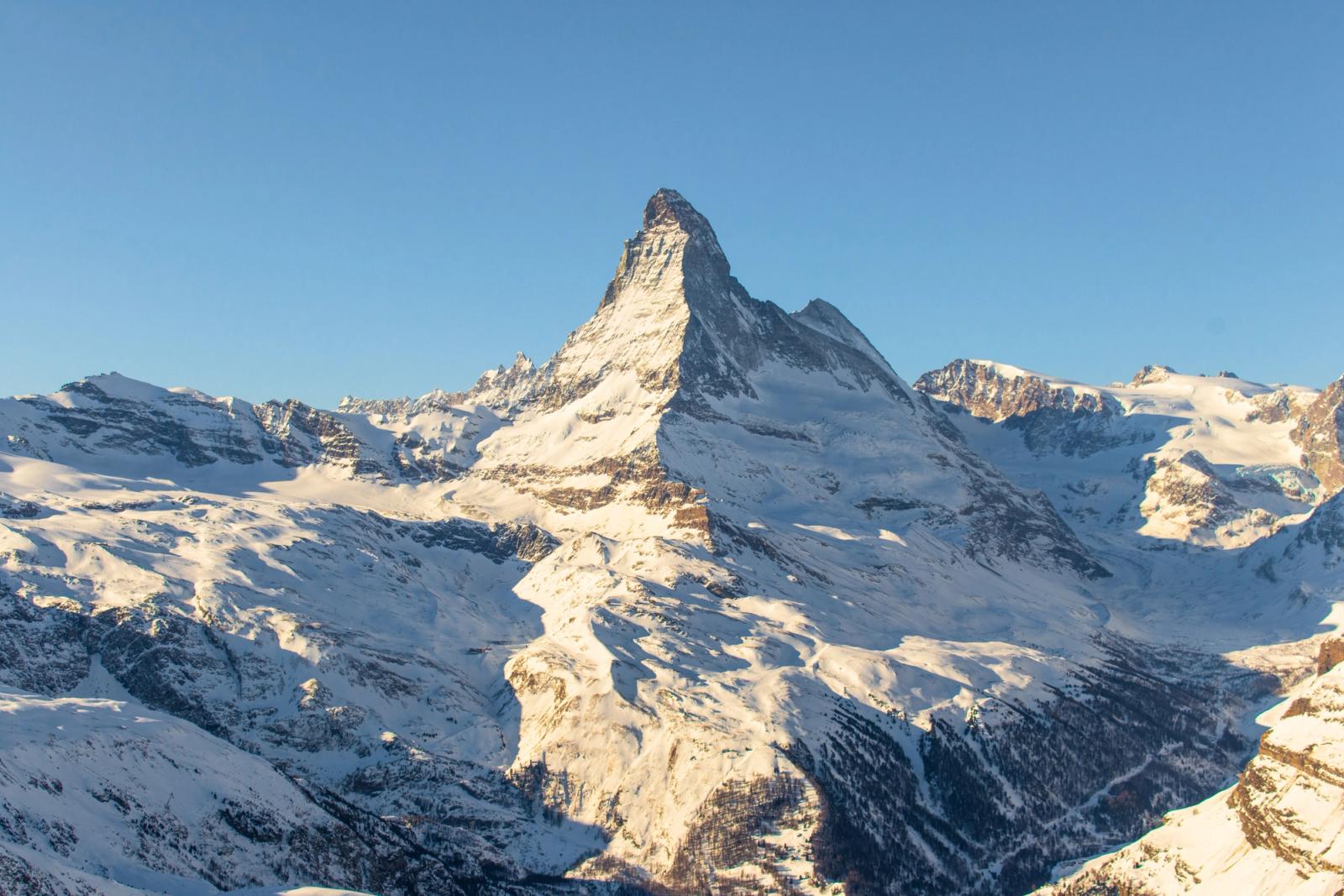 The Matterhorn's jagged snow-covered peak rising against a clear sky