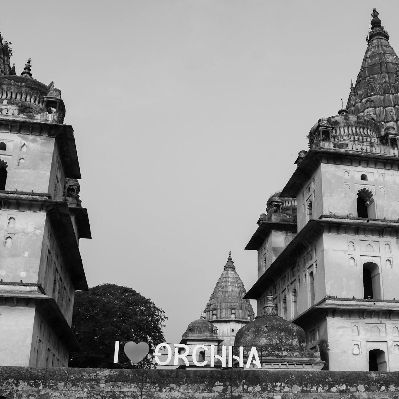 Black and white view of Orchha's temple towers with an I love Orchha sign