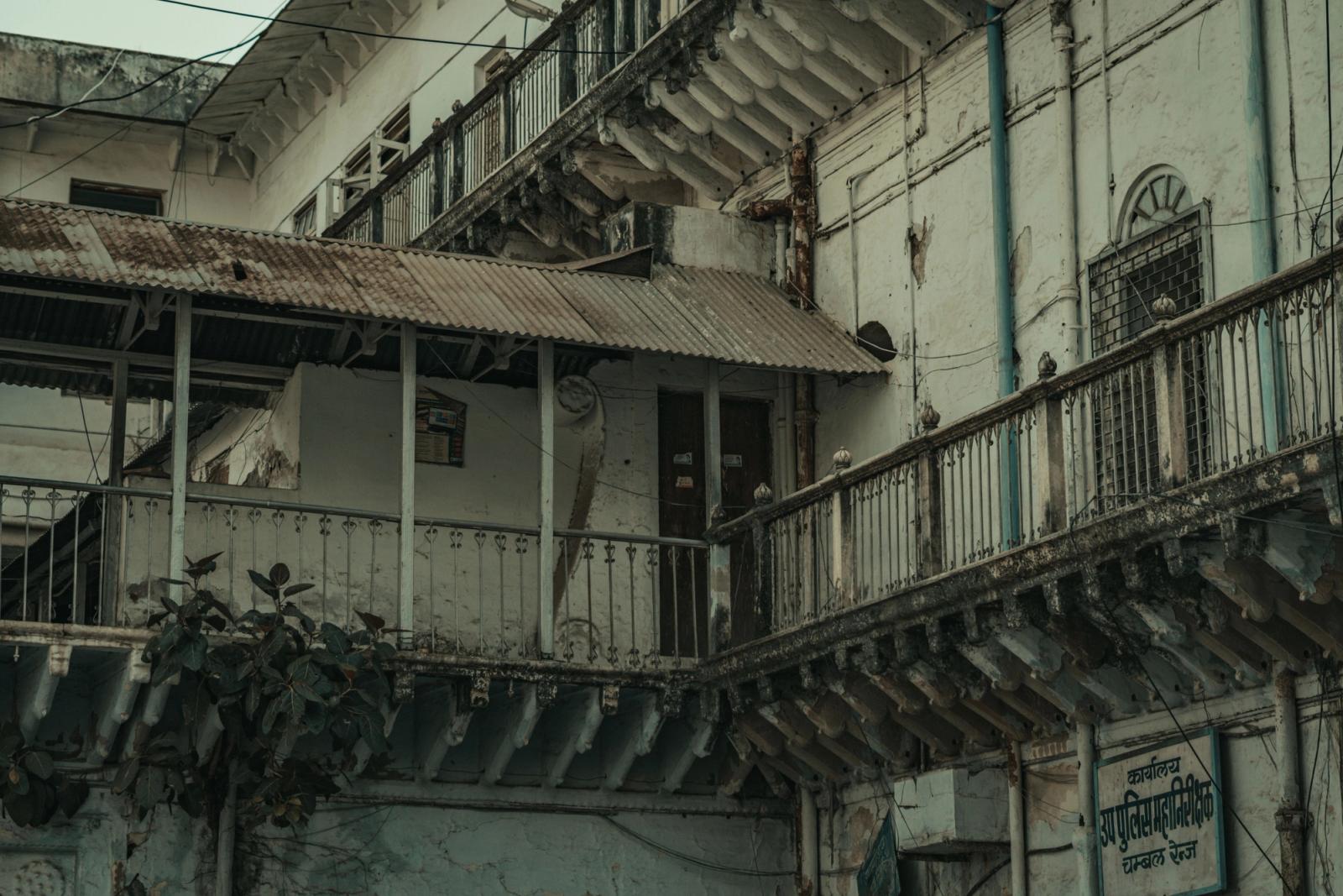 A decaying urban building facade showcasing architectural neglect and heritage decay in India
