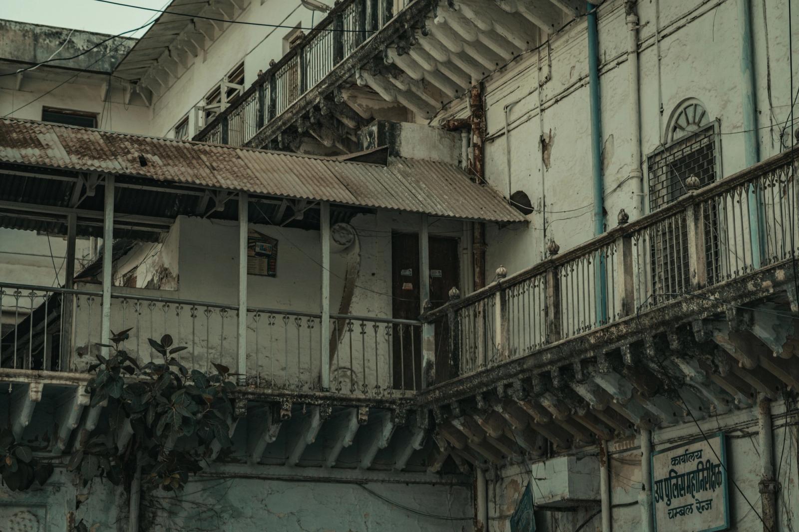 A decaying urban building facade showcasing architectural neglect and heritage decay in India
