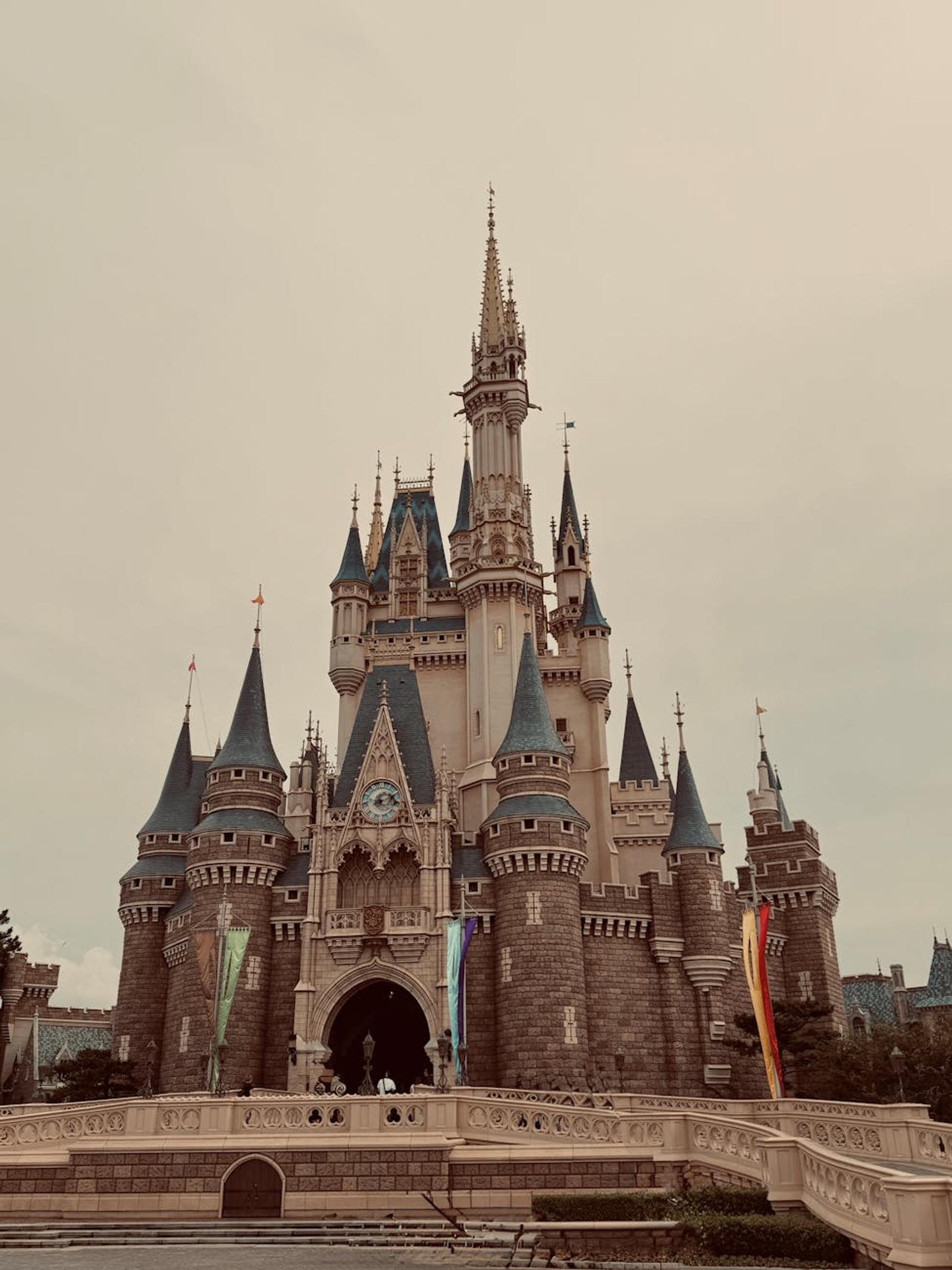 A vintage-style photo of the iconic castle at Tokyo Disneyland on a clear day