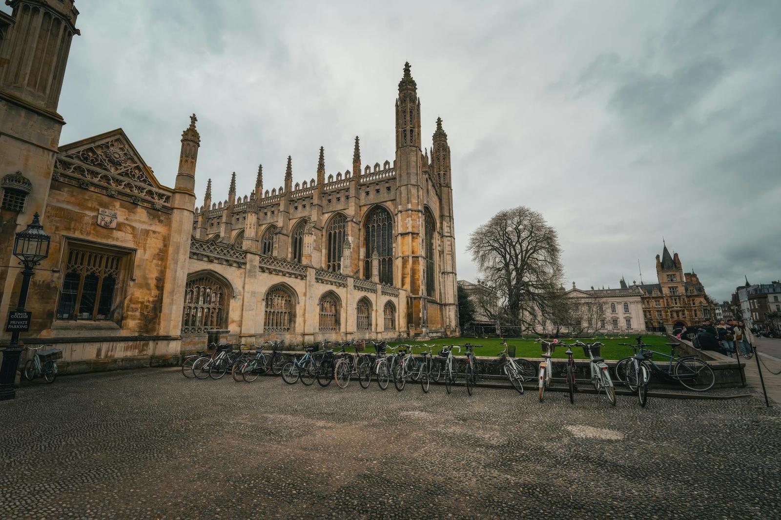 A gothic chapel with tall pinnacles beside a row of parked bicycles