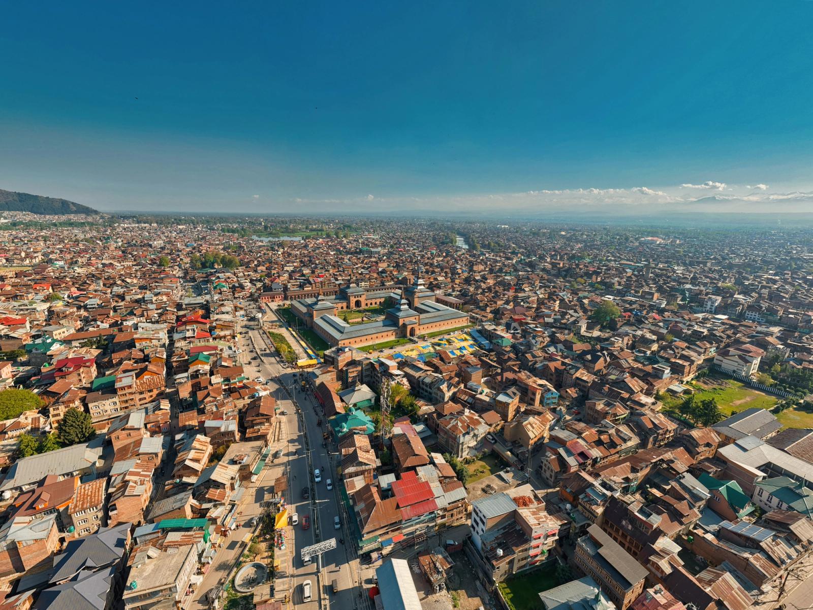 Explore an aerial perspective of Srinagar, showcasing the historic Jamia Masjid amid vibrant city life