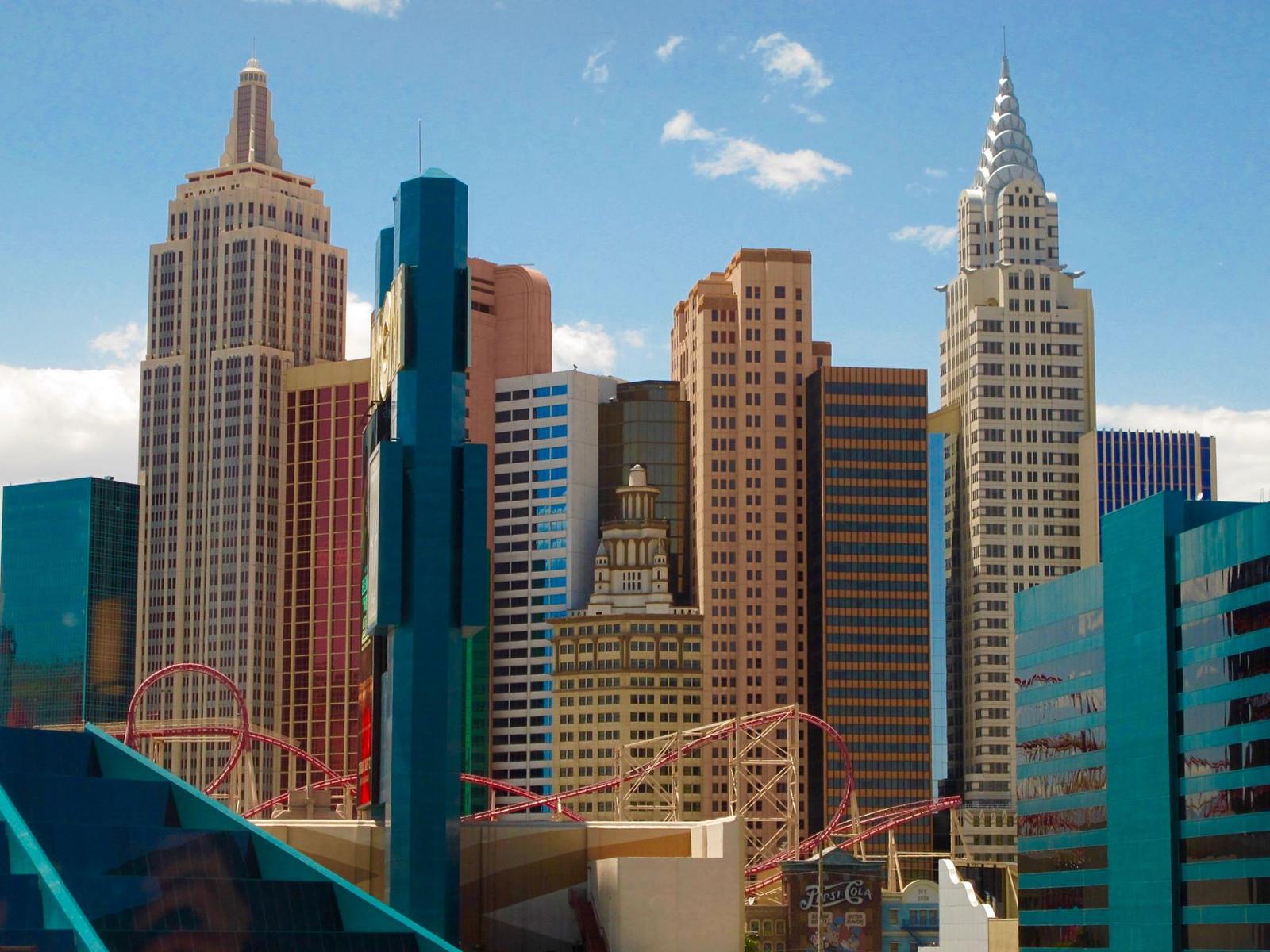 Casino skyline with a roller coaster looping among the towers