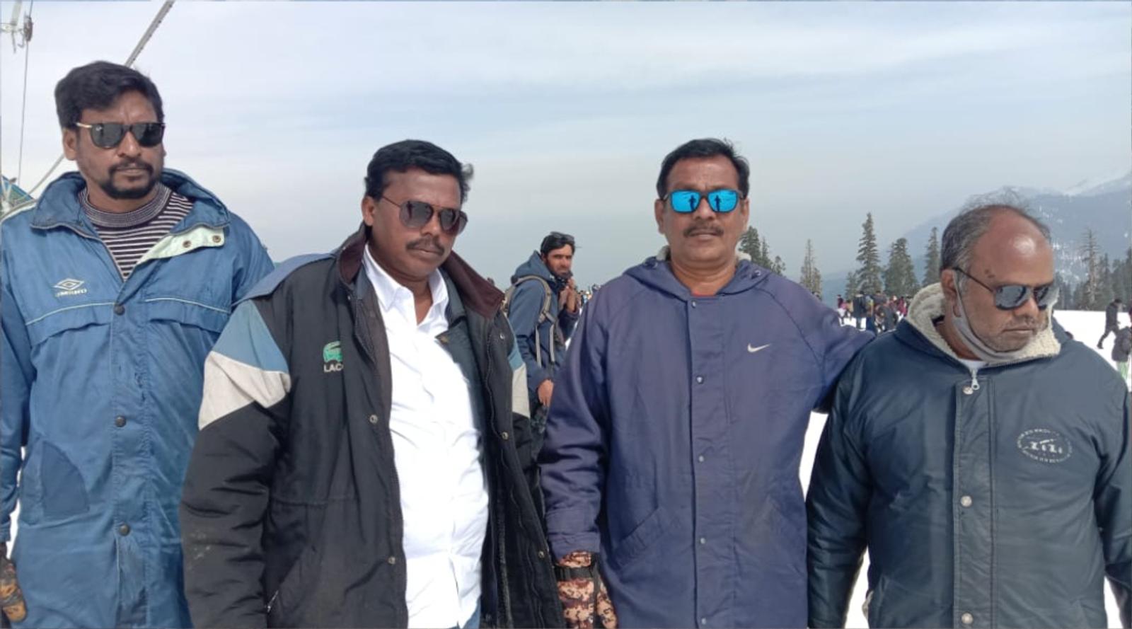 two guys posing in snow area 