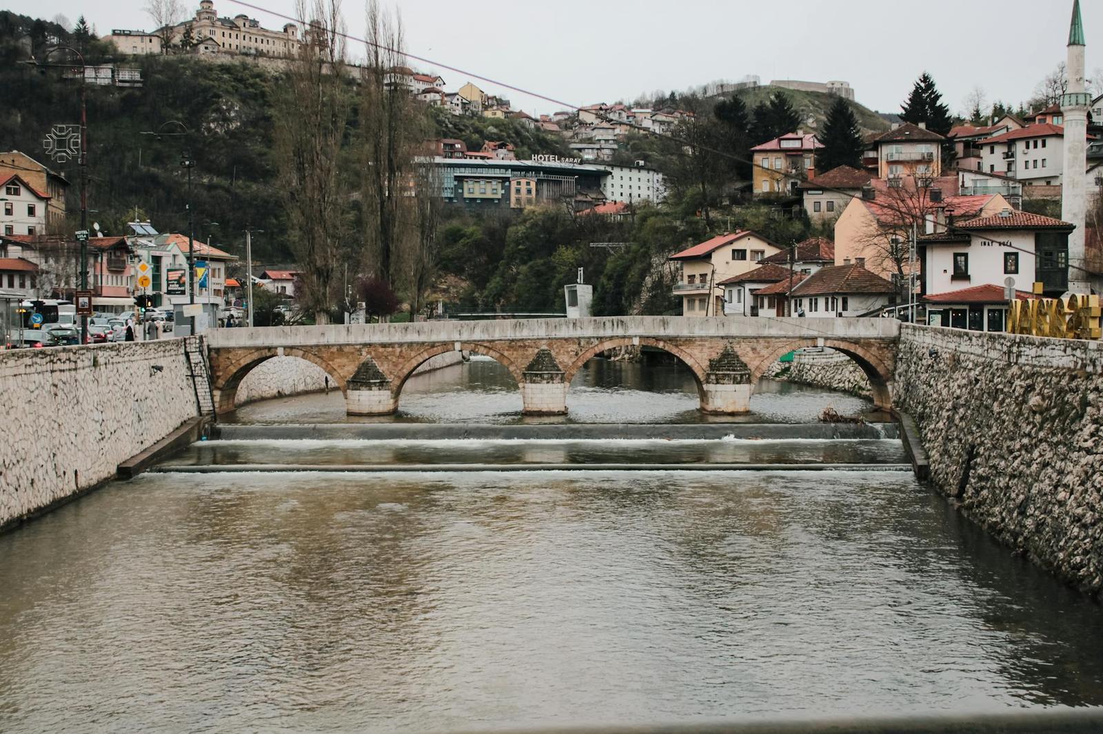 Scenic view of a historic stone bridge over the Miljacka River in Sarajevo, Bosnia and Herzegovina