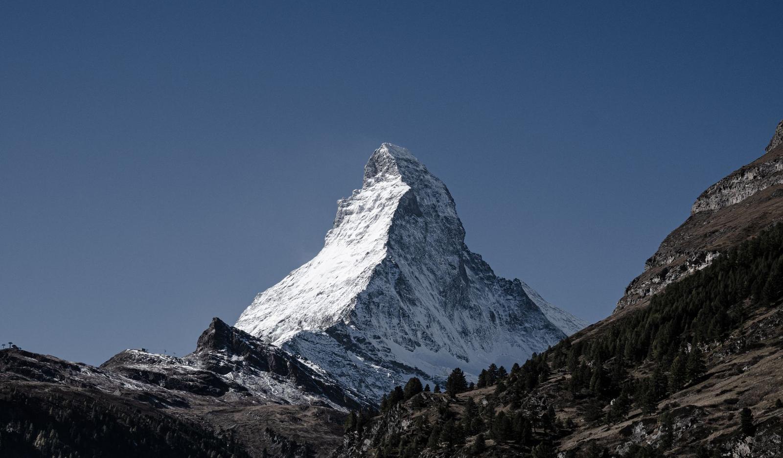 Majestic view of the snow-covered Matterhorn peak in Zermatt, Switzerland under a clear blue sky