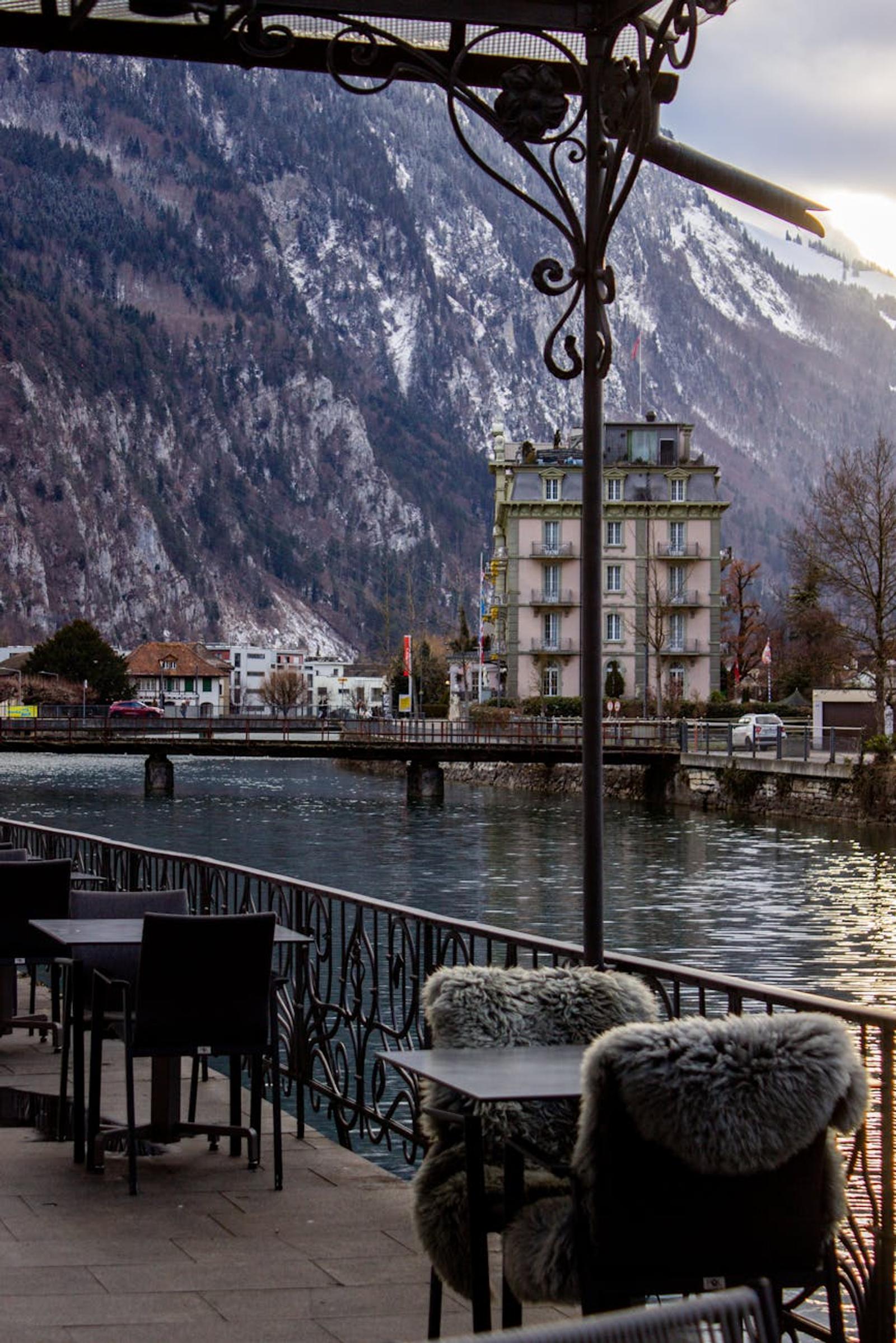 Charming riverside scene in Interlaken with a view of the Alps