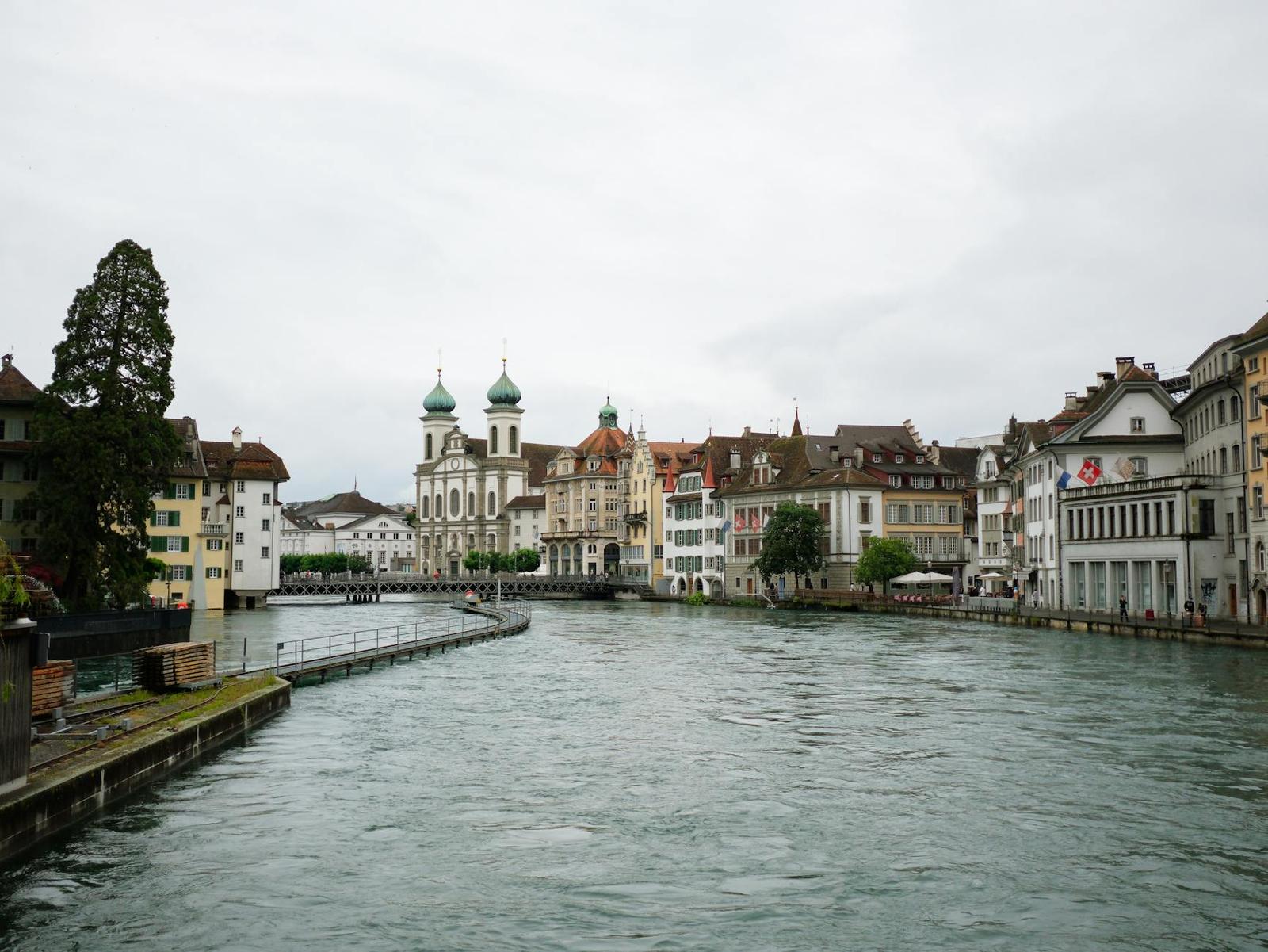 Scenic view of Luzern cityscape featuring historic architecture along the Reuss River