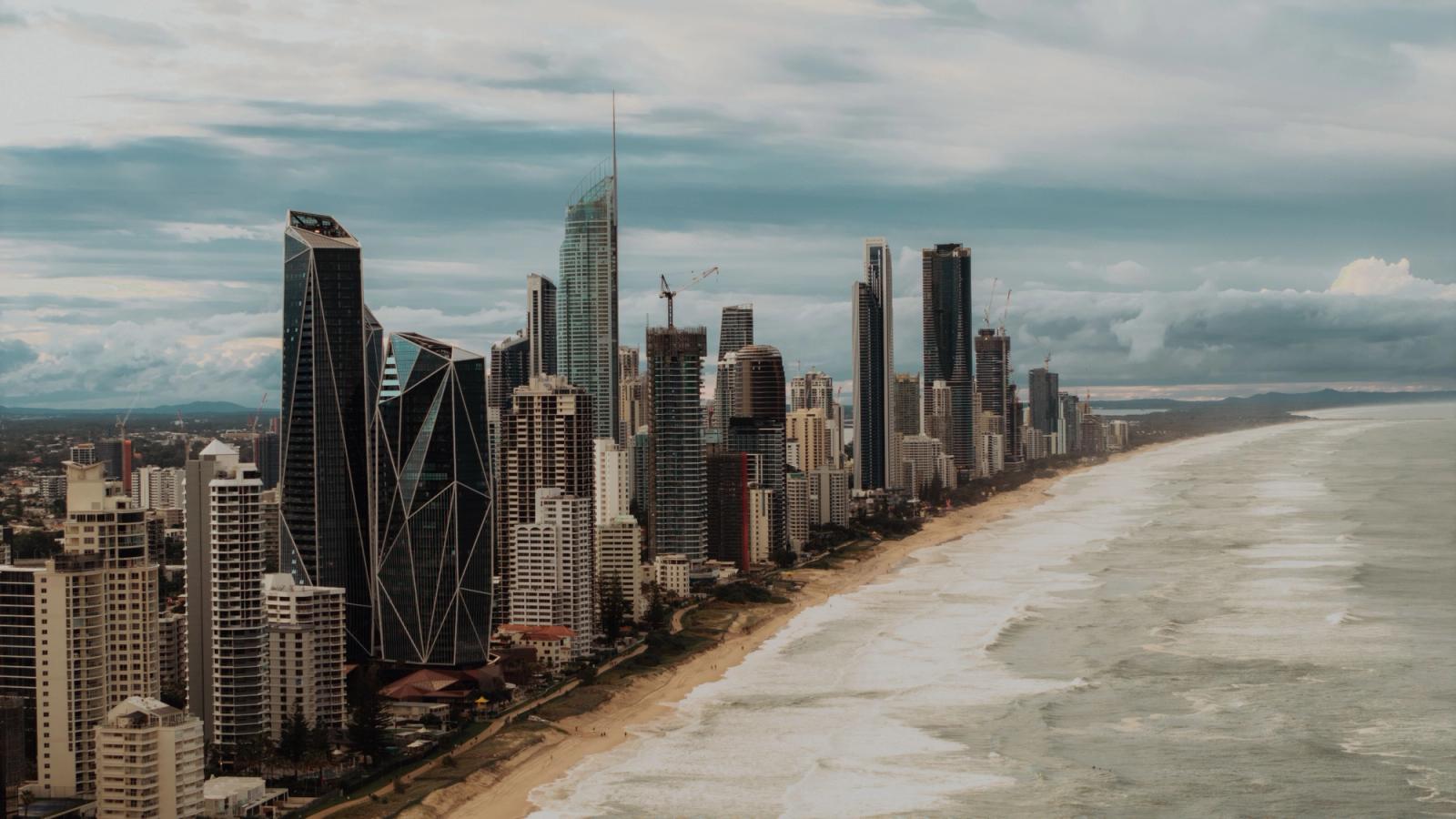 Stunning aerial view of Gold Coast skyline, Queensland, Australia with tall skyscrapers lining the beach
