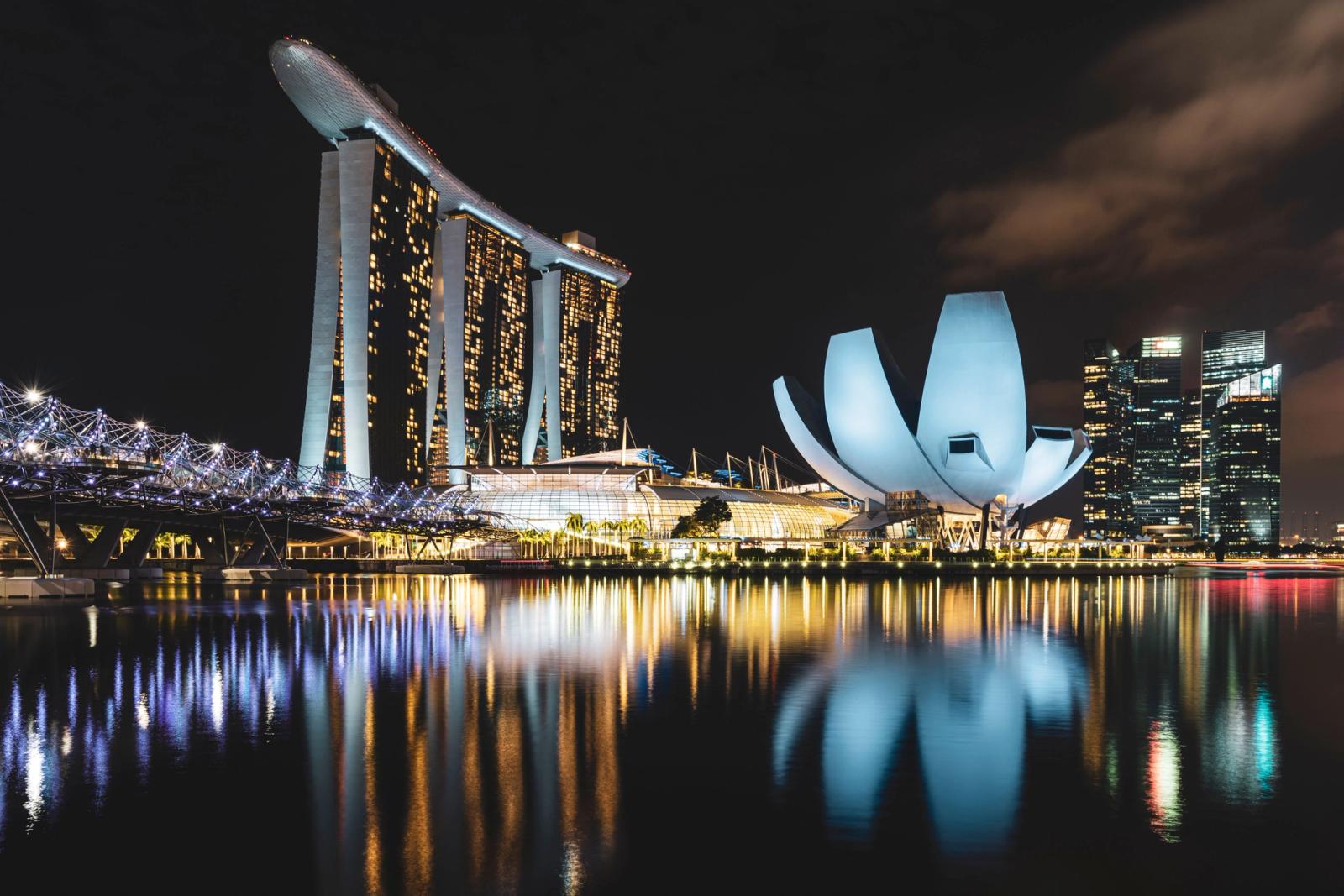 Stunning night view of Marina Bay Sands and ArtScience Museum reflecting on Singapore harbor