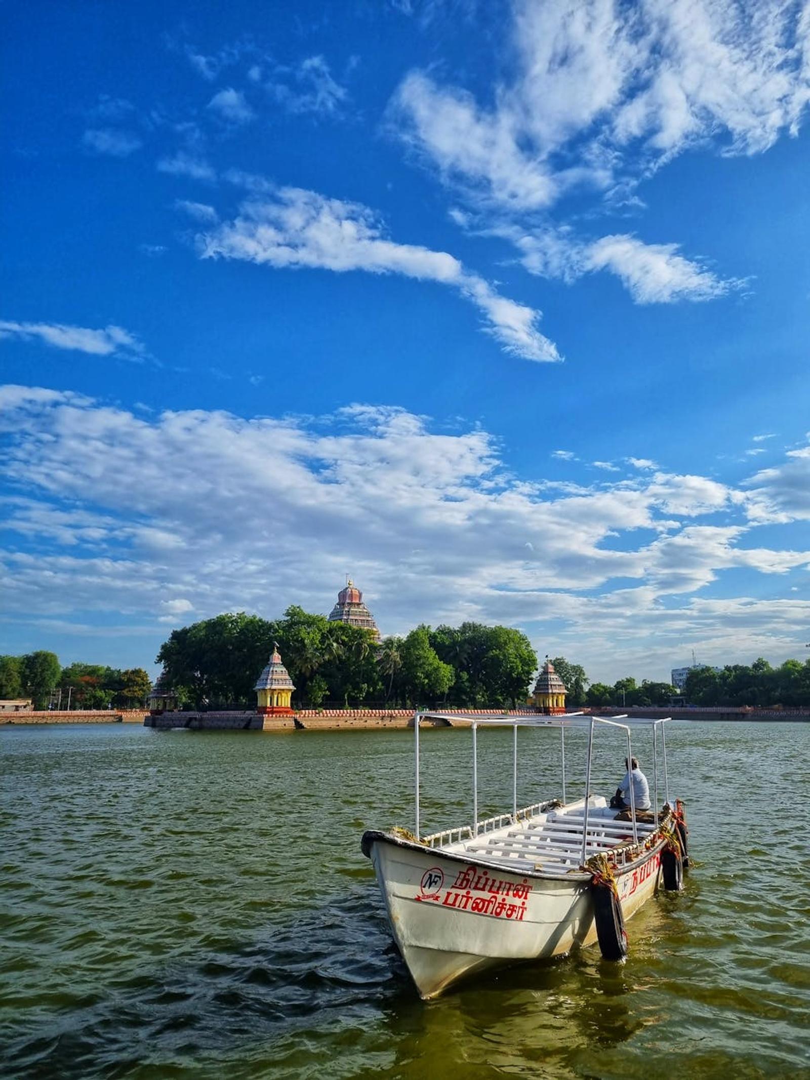 Colorful boat near Meenakshi Amman Temple in Madurai, India, under a vibrant sky
