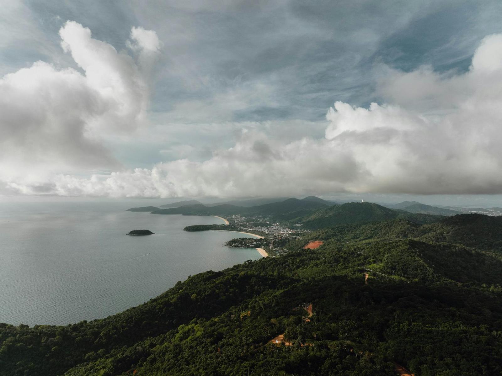 Cloud-covered hills above a bay dotted with small islands