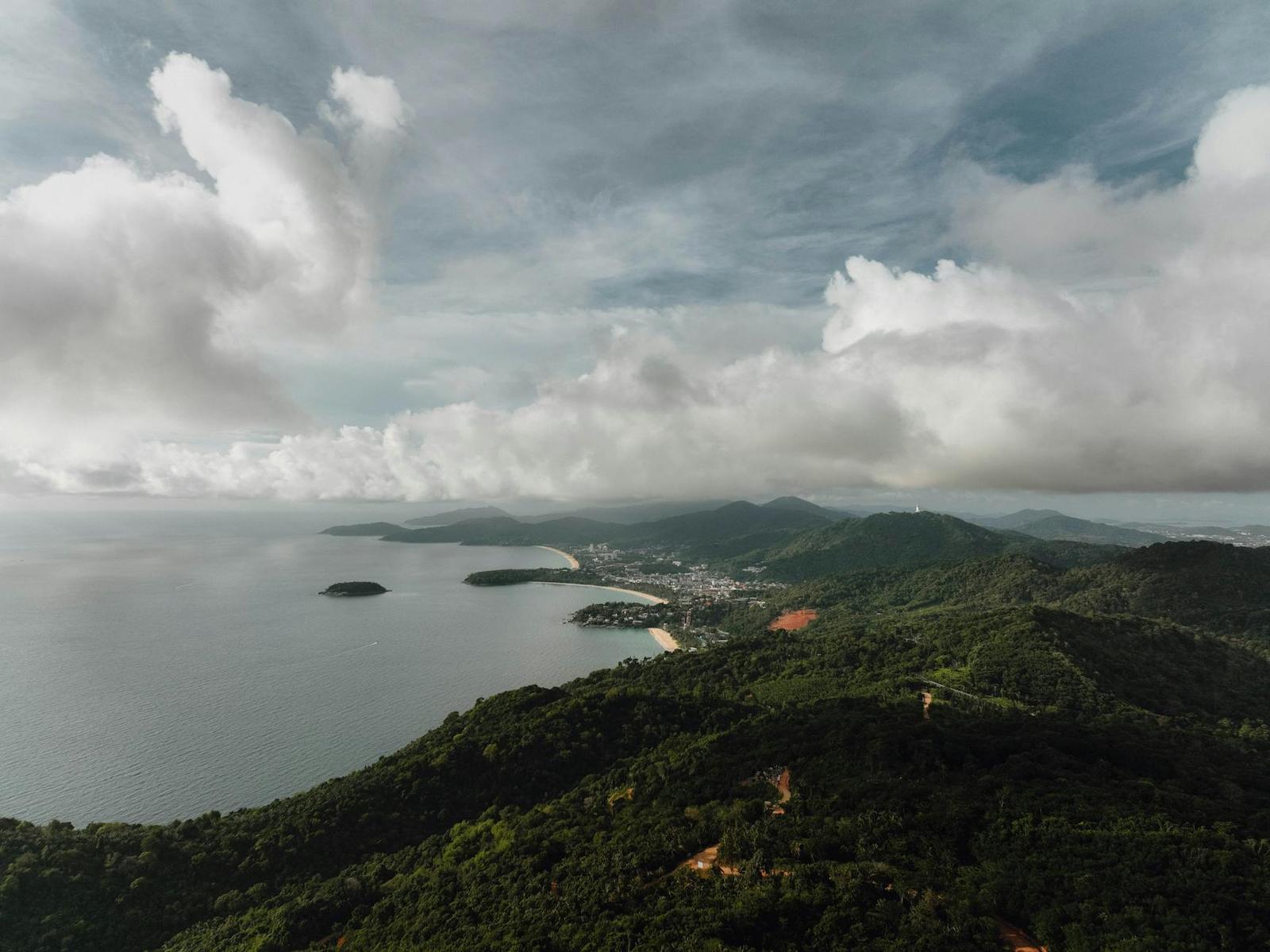 Cloud-covered hills above a bay dotted with small islands