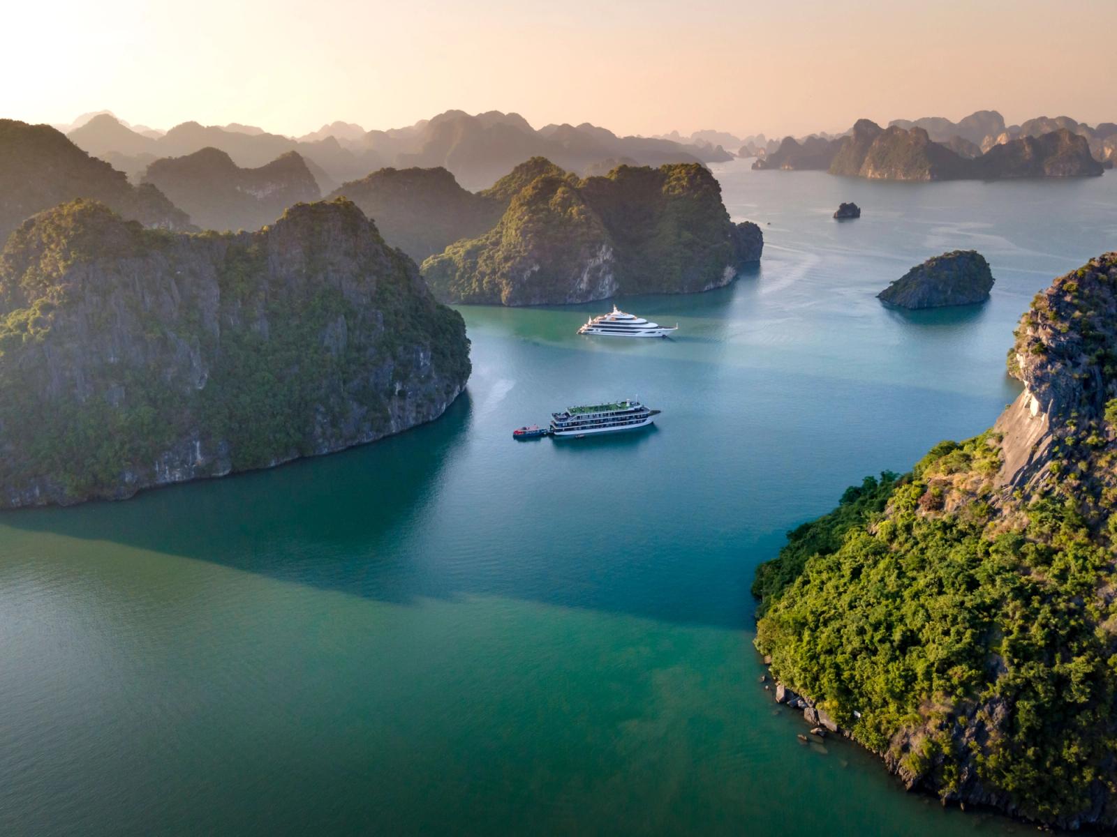 Stunning aerial view of cruise ships navigating the scenic Halong Bay in Vietnam