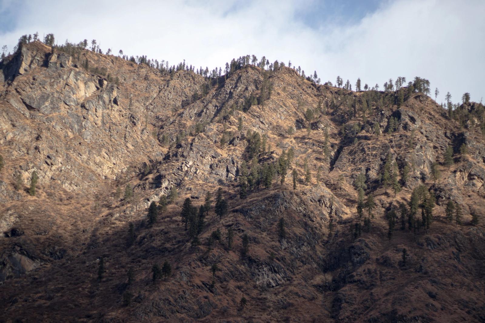 Majestic rocky mountain landscape in Sosan, Himachal Pradesh, India under a clear sky