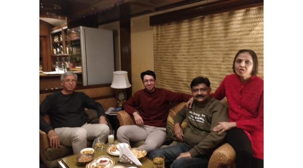 Four people seated on a sofa