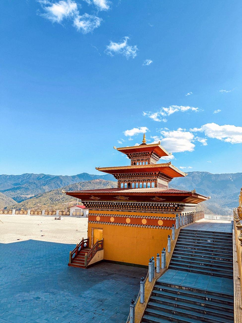 Explore the serene beauty of a Bhutanese temple against the stunning Himalayan backdrop