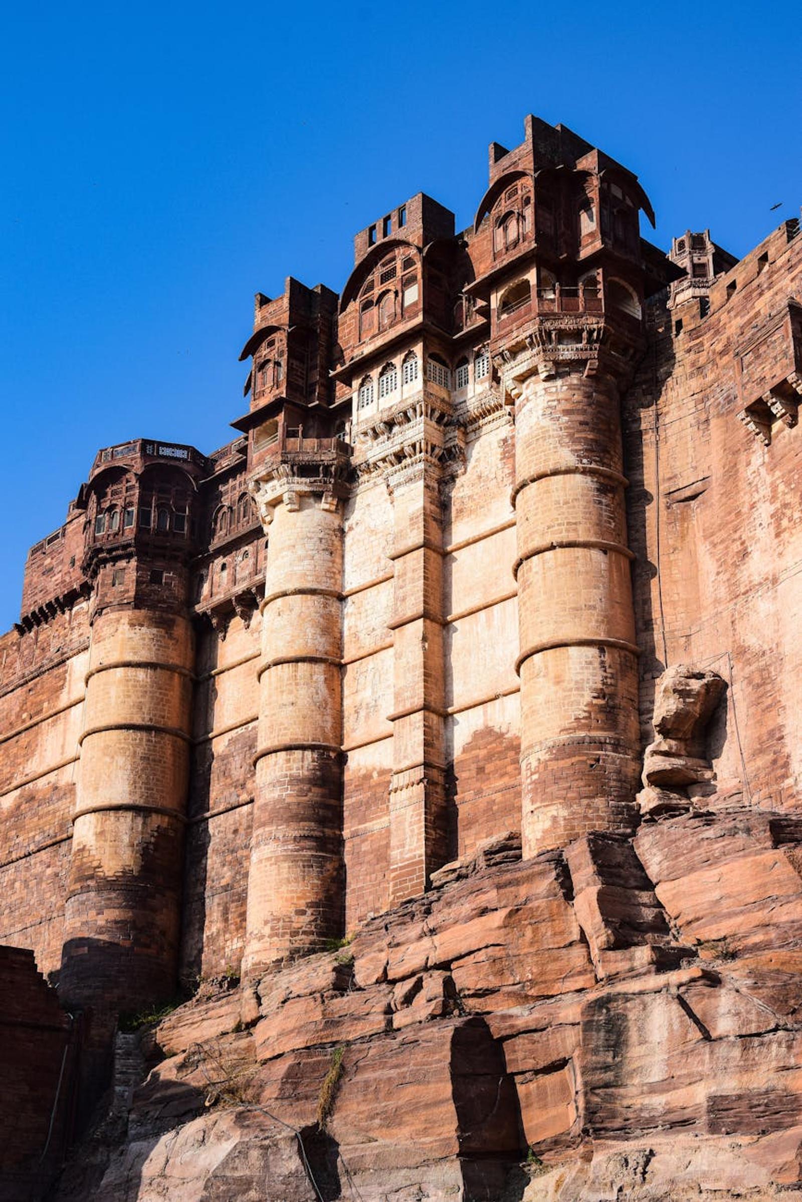 Explore the majestic architecture of the historic Mehrangarh Fort in Jodhpur, India under a clear blue sky