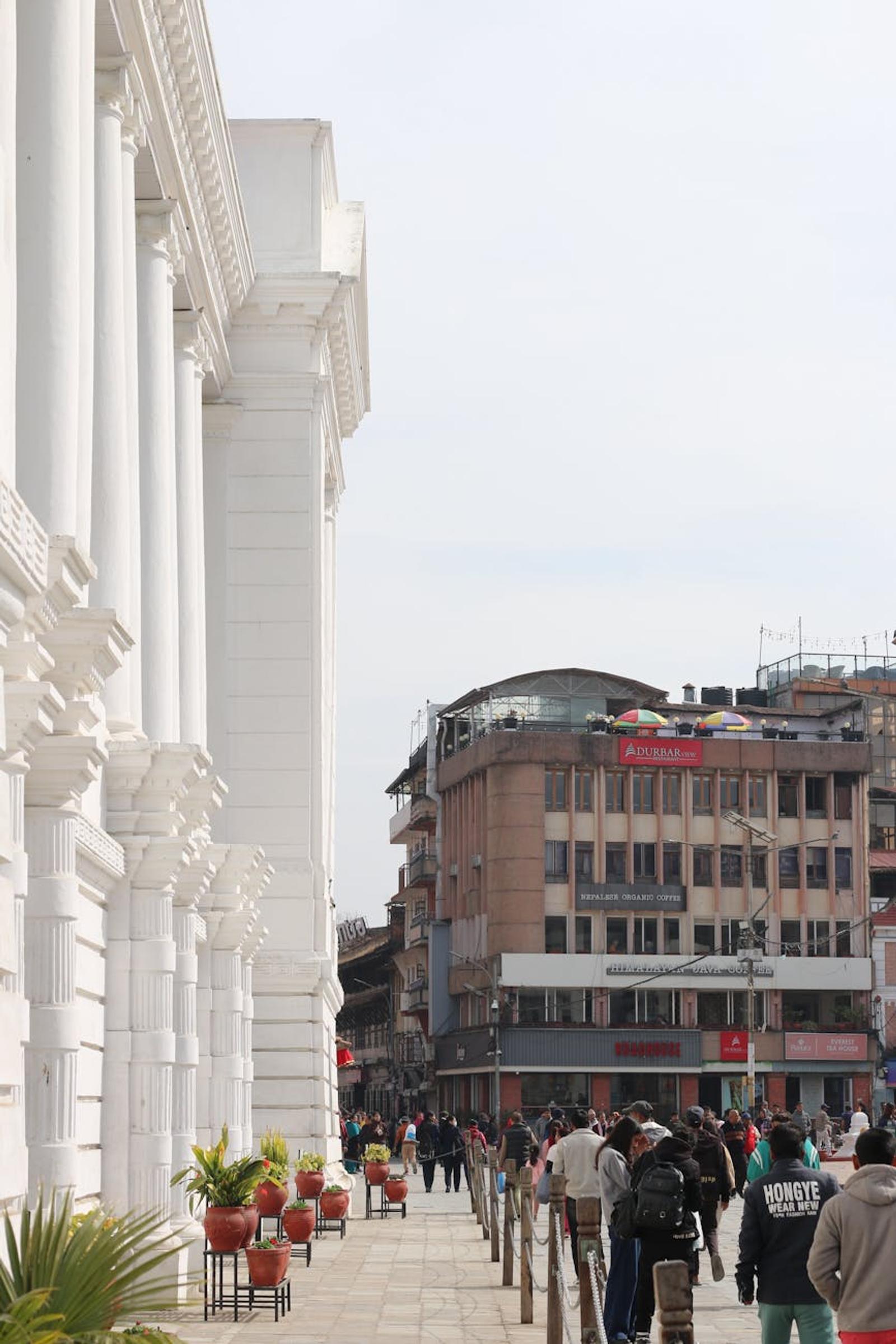 Street view in Kathmandu with historic architecture and lively crowd