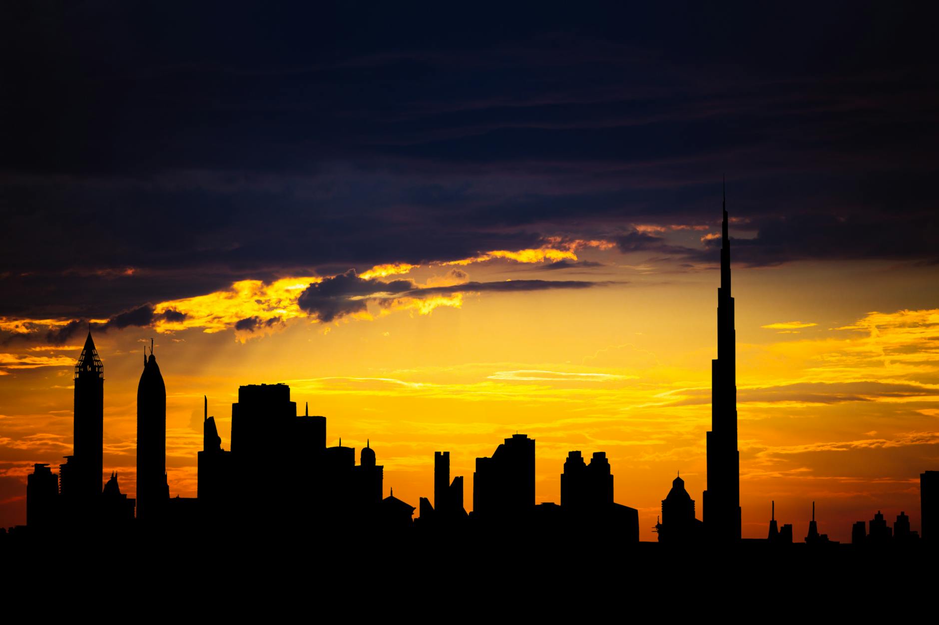 Dubai skyline at golden hour with Burj Khalifa rising above the city