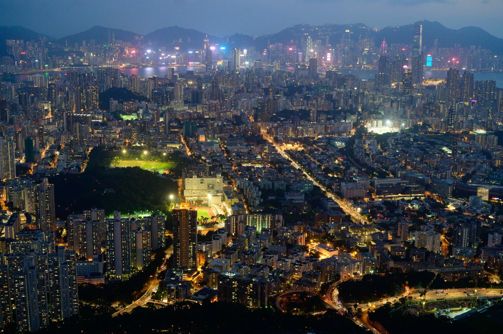 A breathtaking aerial shot capturing the vibrant Hong Kong skyline illuminated at night