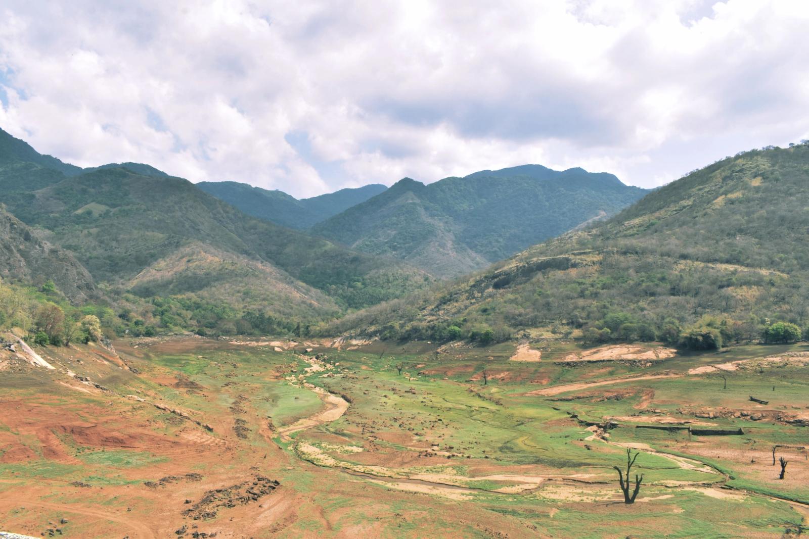 Explore the serene mountain range and valleys of Tenkasi, India. Perfect for nature lovers