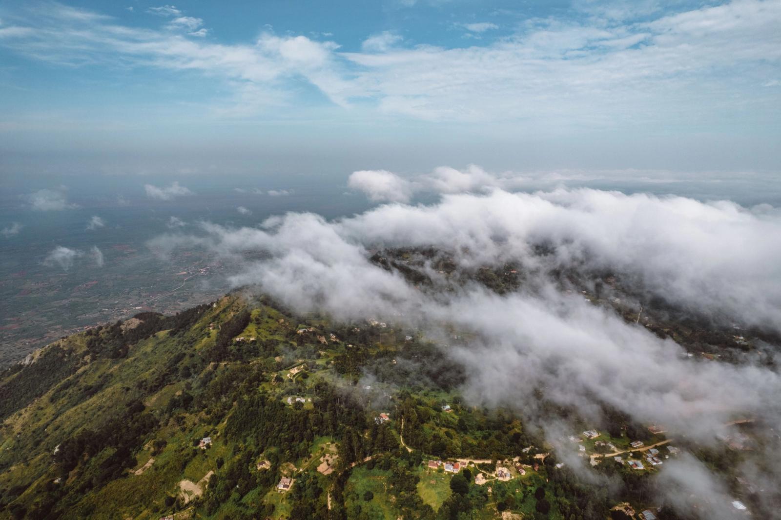 Captivating aerial view of lush Mwanda hills under a blanket of clouds in Kenya