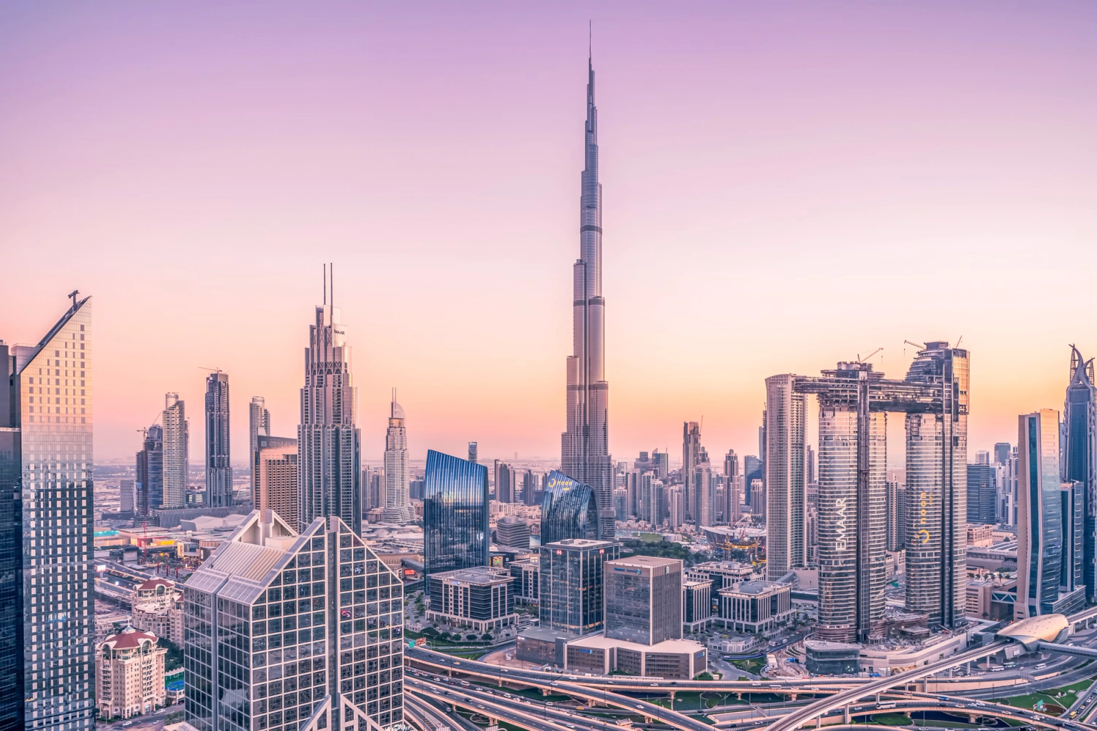 The Burj Khalifa towering over the Dubai skyline at sunset