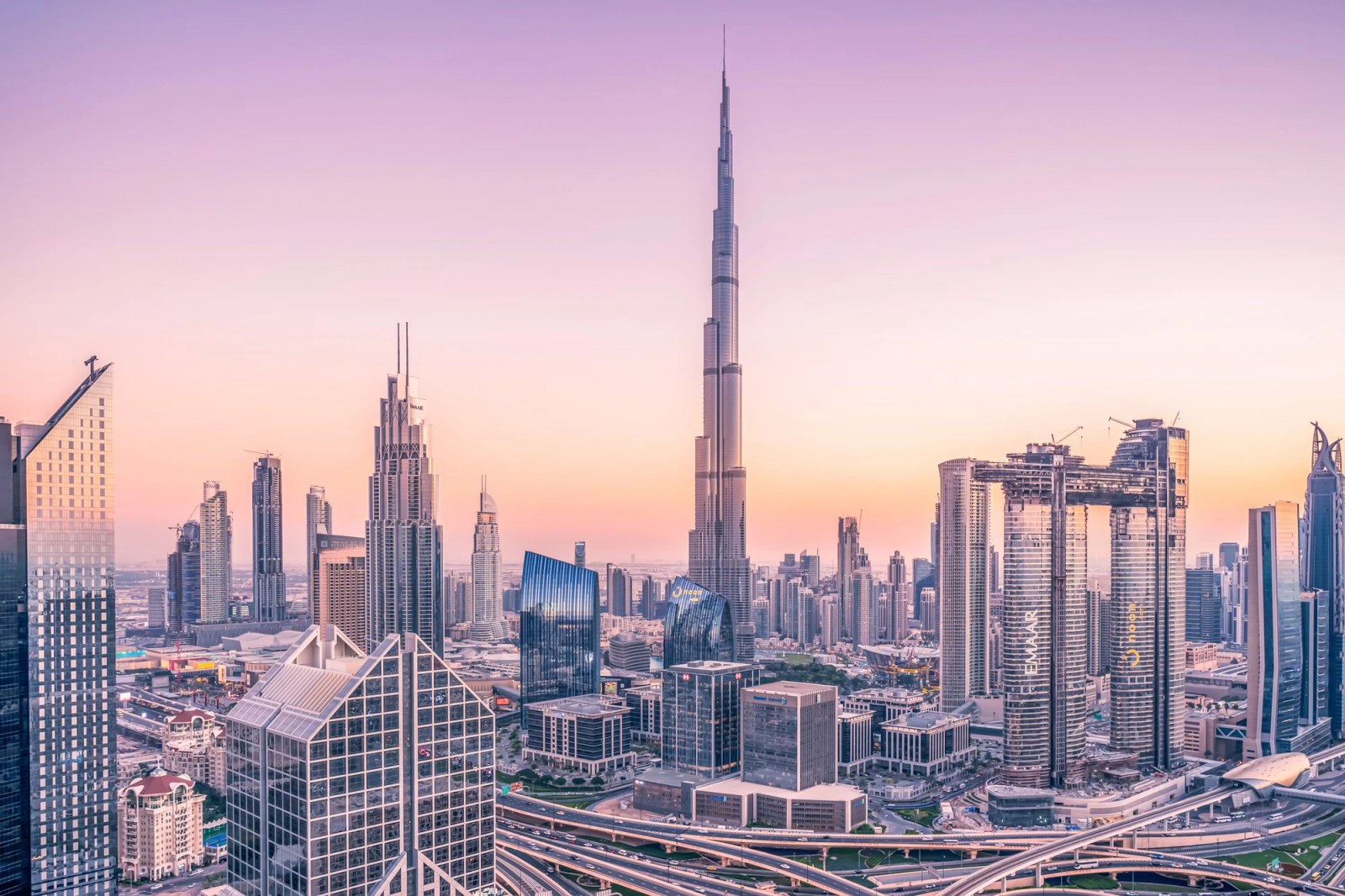The Burj Khalifa towering over the Dubai skyline at sunset