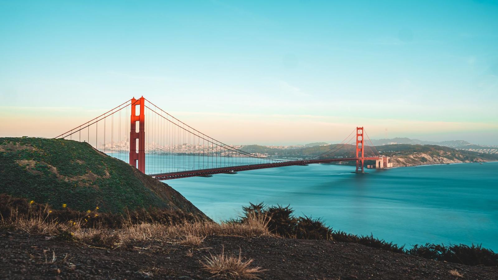 Golden Gate Bridge spanning the bay at golden hour